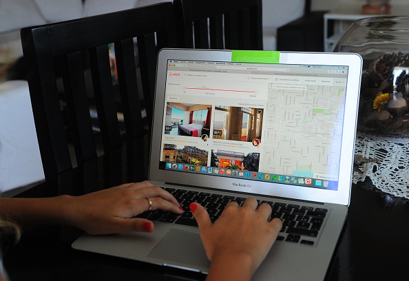 An Airbnb user navigates the site in Havana on July 10, 2015.