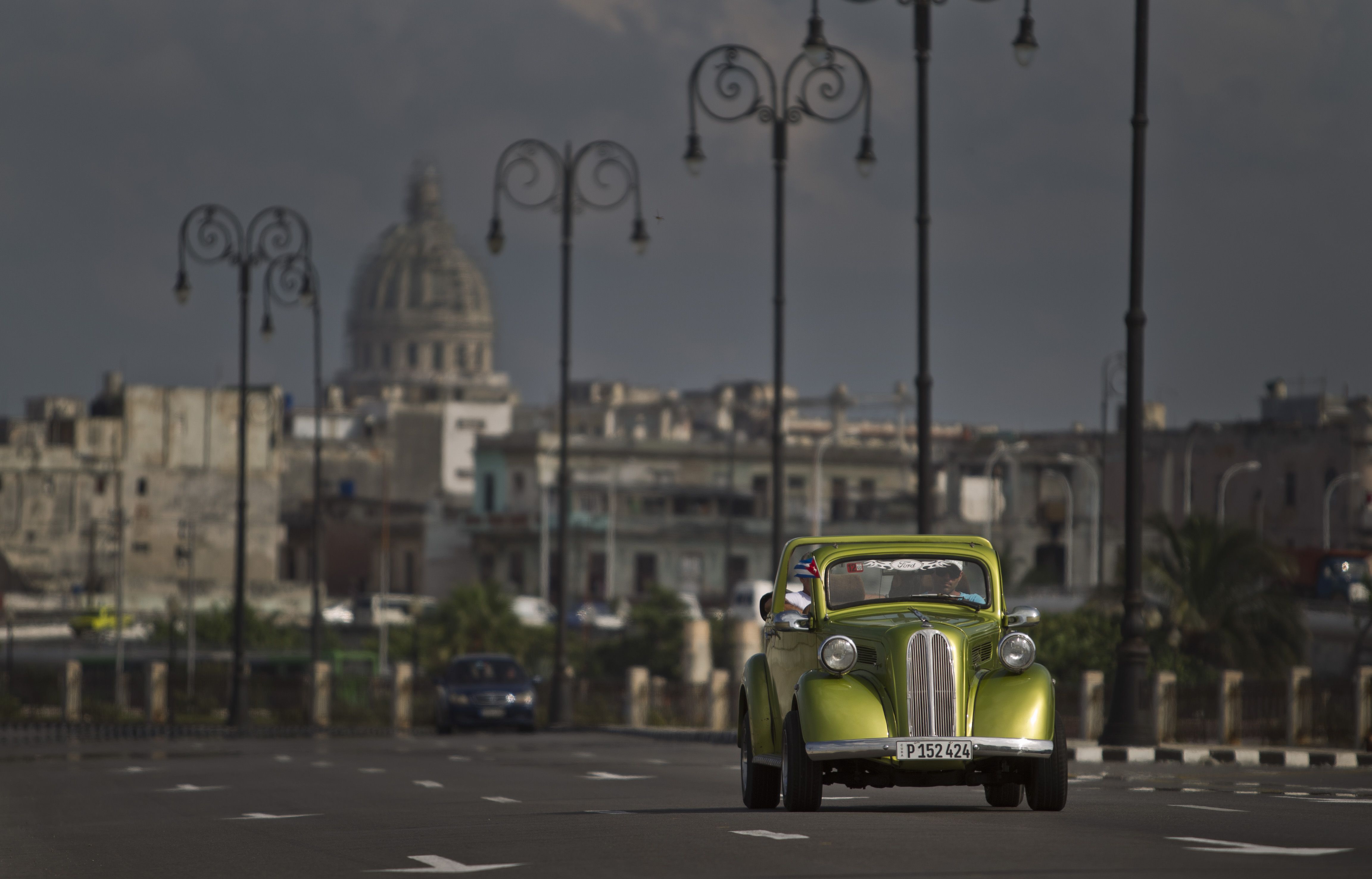 A man drives a classic American car on The Malecon in Havana, Cuba. (Franklin Reyes&mdash;AP)