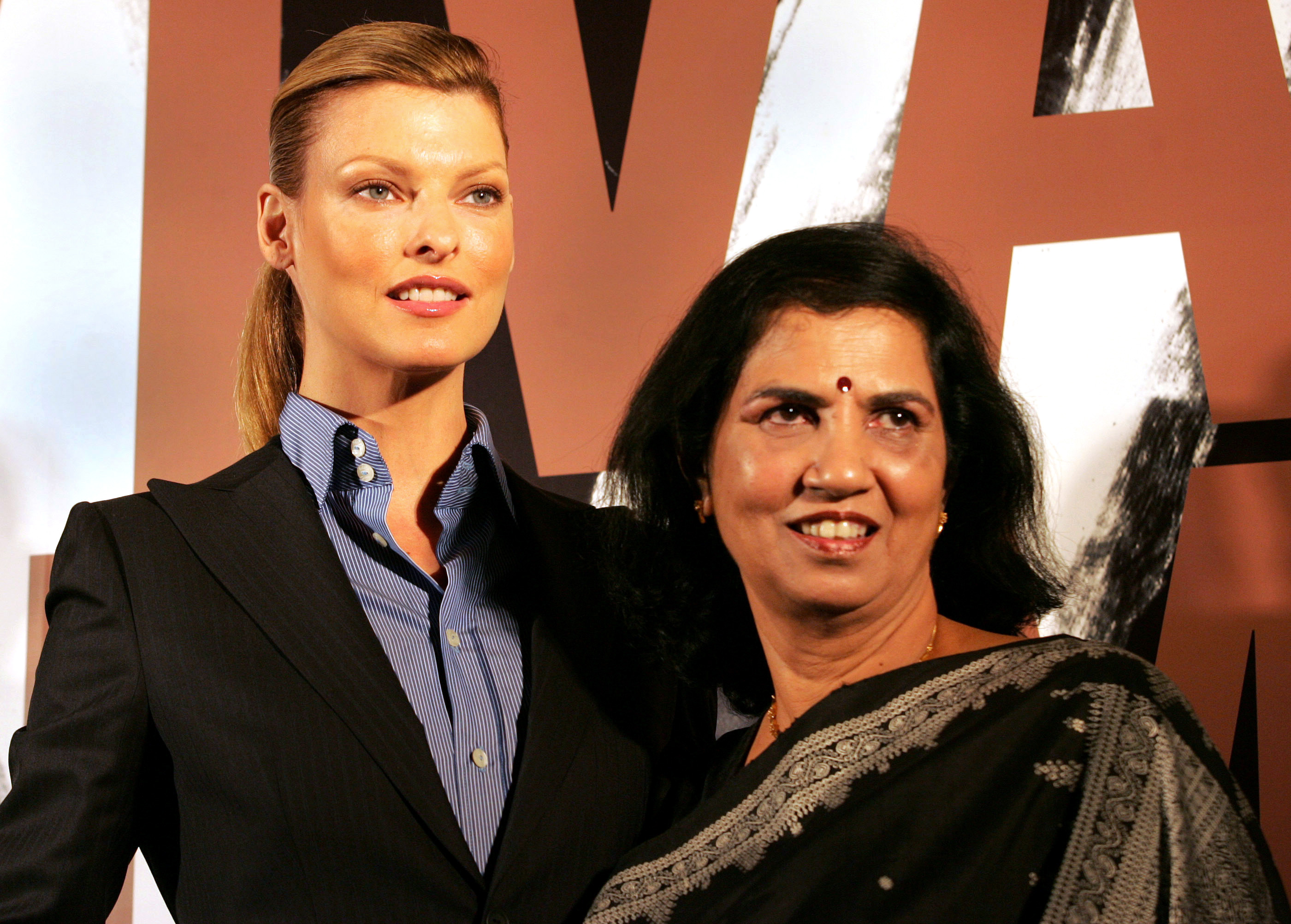 Canadian supermodel Linda Evangelista, left, and Director of Y.R. Gaitonde Center for AIDS Research and Education Suniti Solomon at a charity function in Mumbai, India on Oct. 21, 2005 (Rajesh Nirgude—AP)