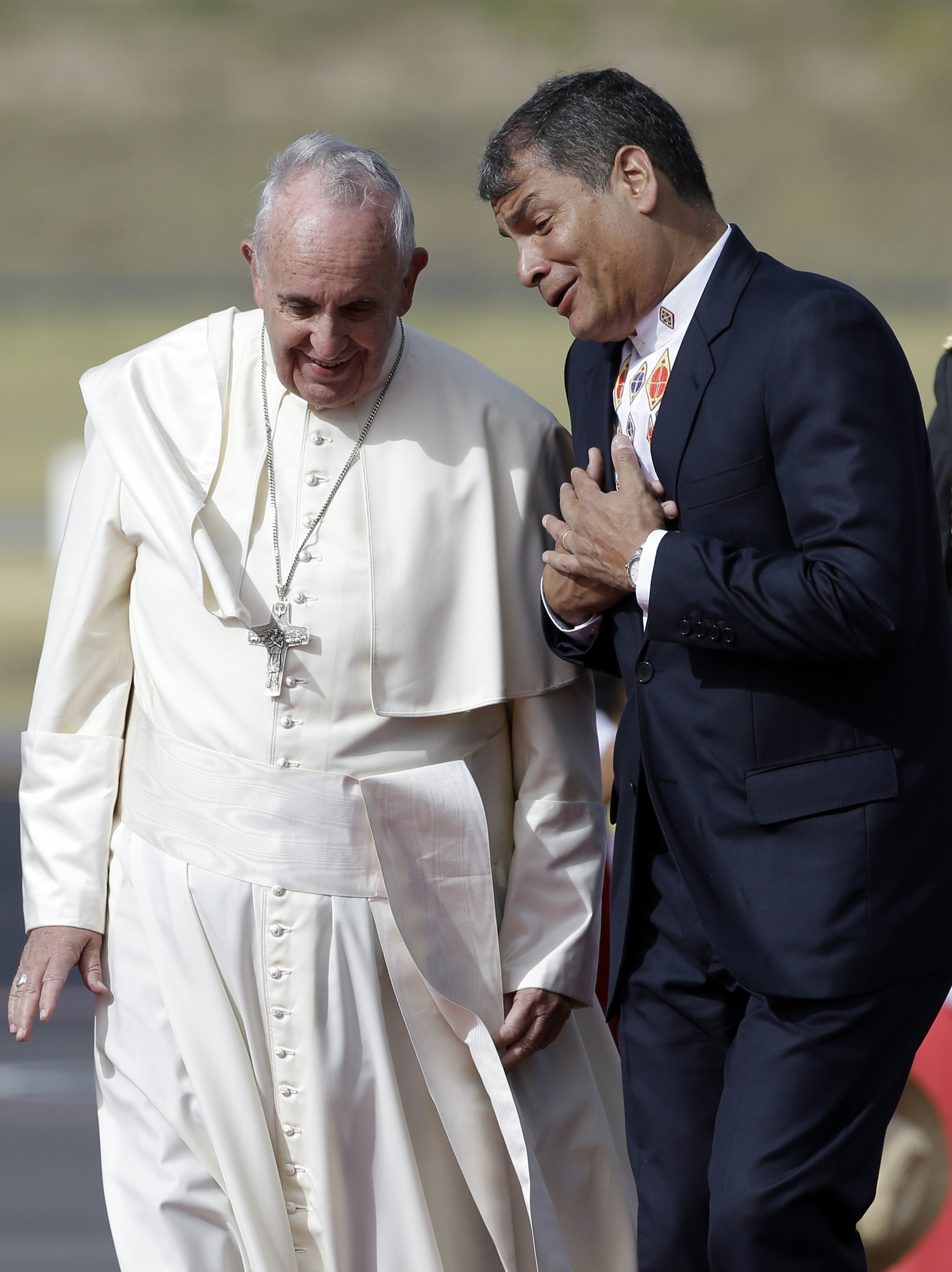 Ecuador's President Rafael Correa, right, welcomes Pope Francis upon his arrival at Quito Airport, Ecuador, Sunday, July 5, 2015. The Pontiff is visiting Ecuador, Bolivia and Paraguay on the occasion of his Apostolic trip from July 5 to July 12. (Gregorio Borgia–AP)