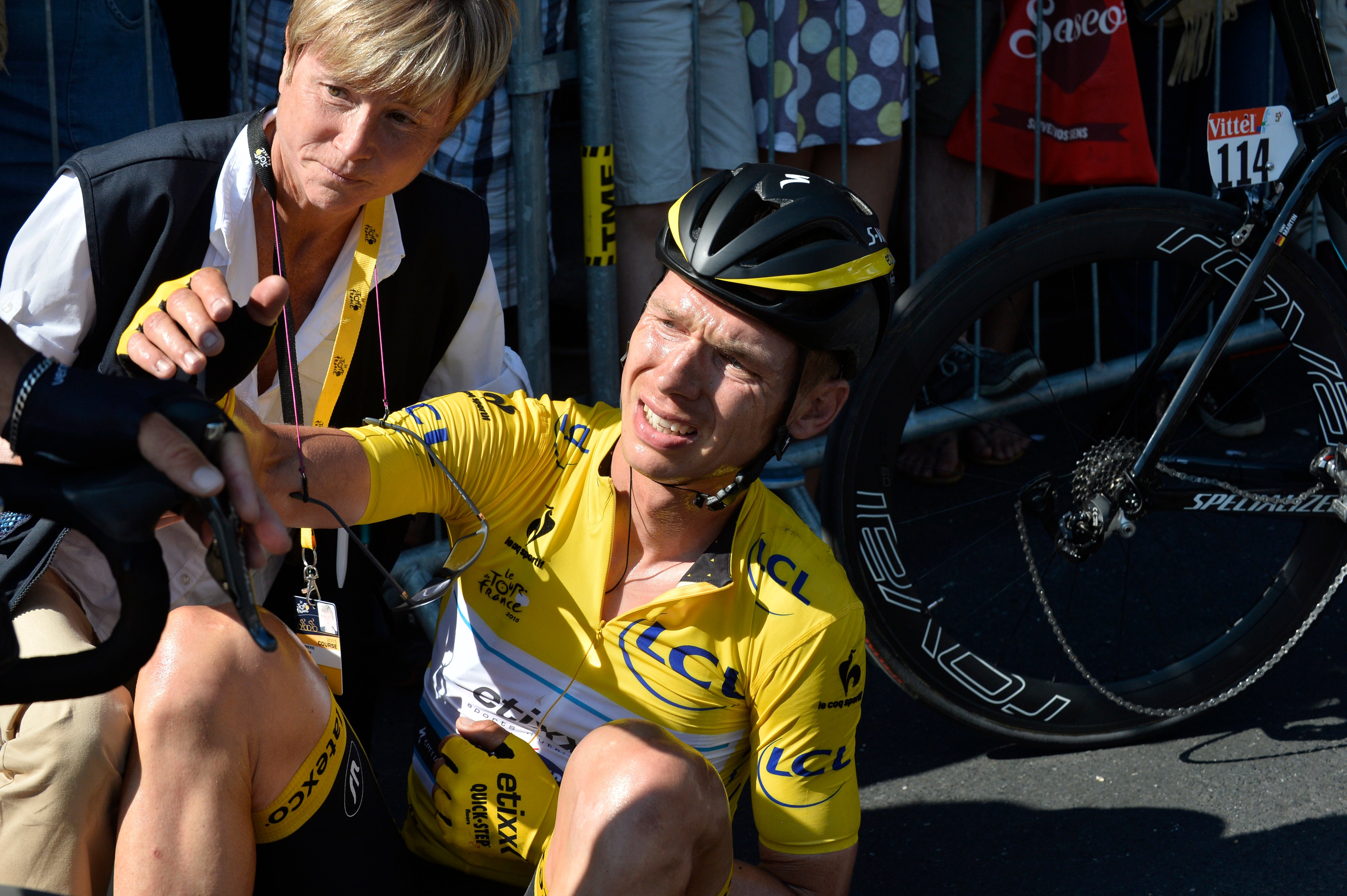 Germany's Tony Martin, wearing the overall leader's yellow jersey, lies on the road with a broken collar bone after crashing in the last kilometers of the sixth stage of the Tour de France cycling race over 191.5 kilometers (119 miles) with start in Abbeville and finish in Le Havre, France, July 9, 2015 (Stephane Mantey—AP)