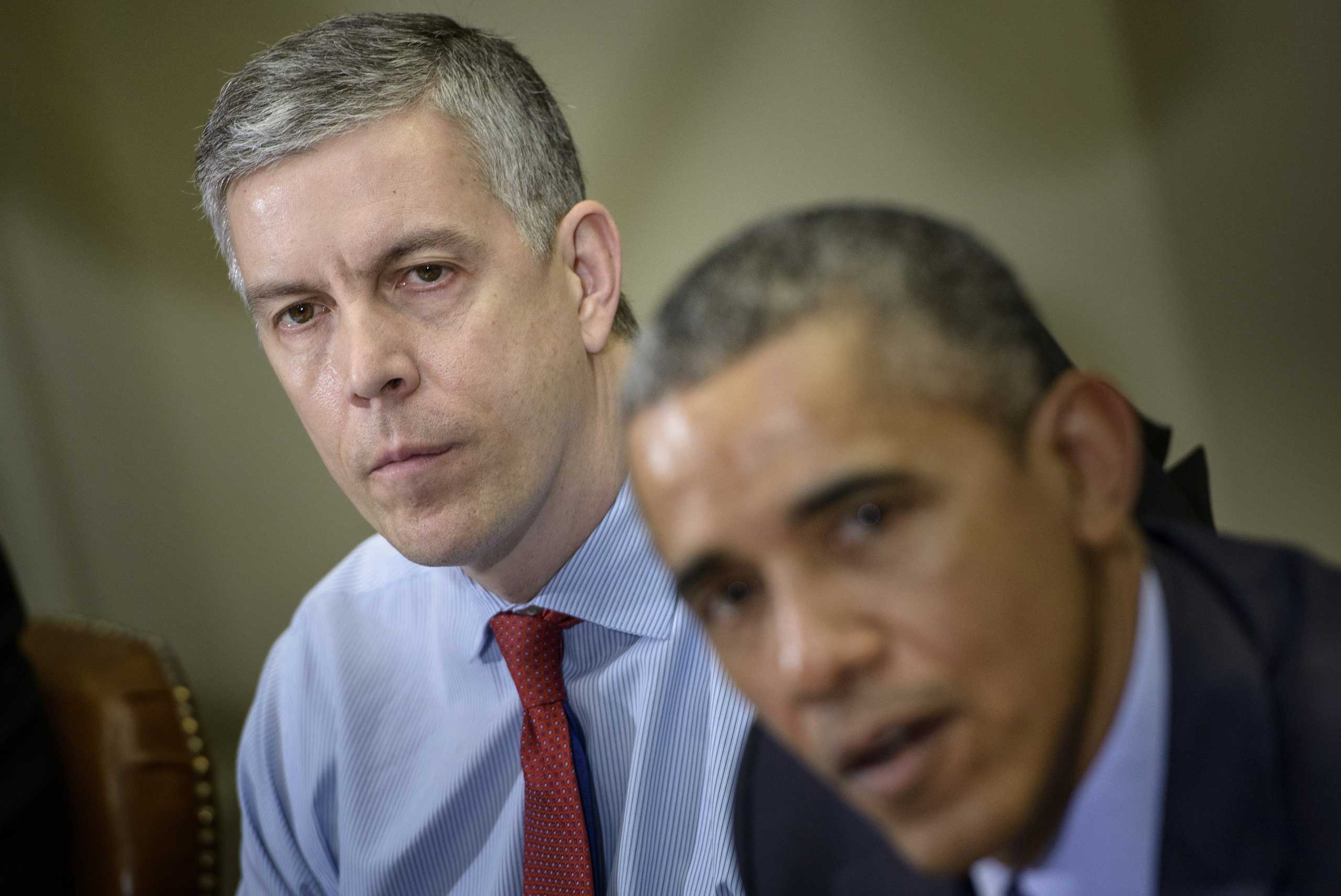 Secretary of Education Arne Duncan with President Obama at the White House, in March 2015. (Brendan Smialowski—AFP/Getty Images)