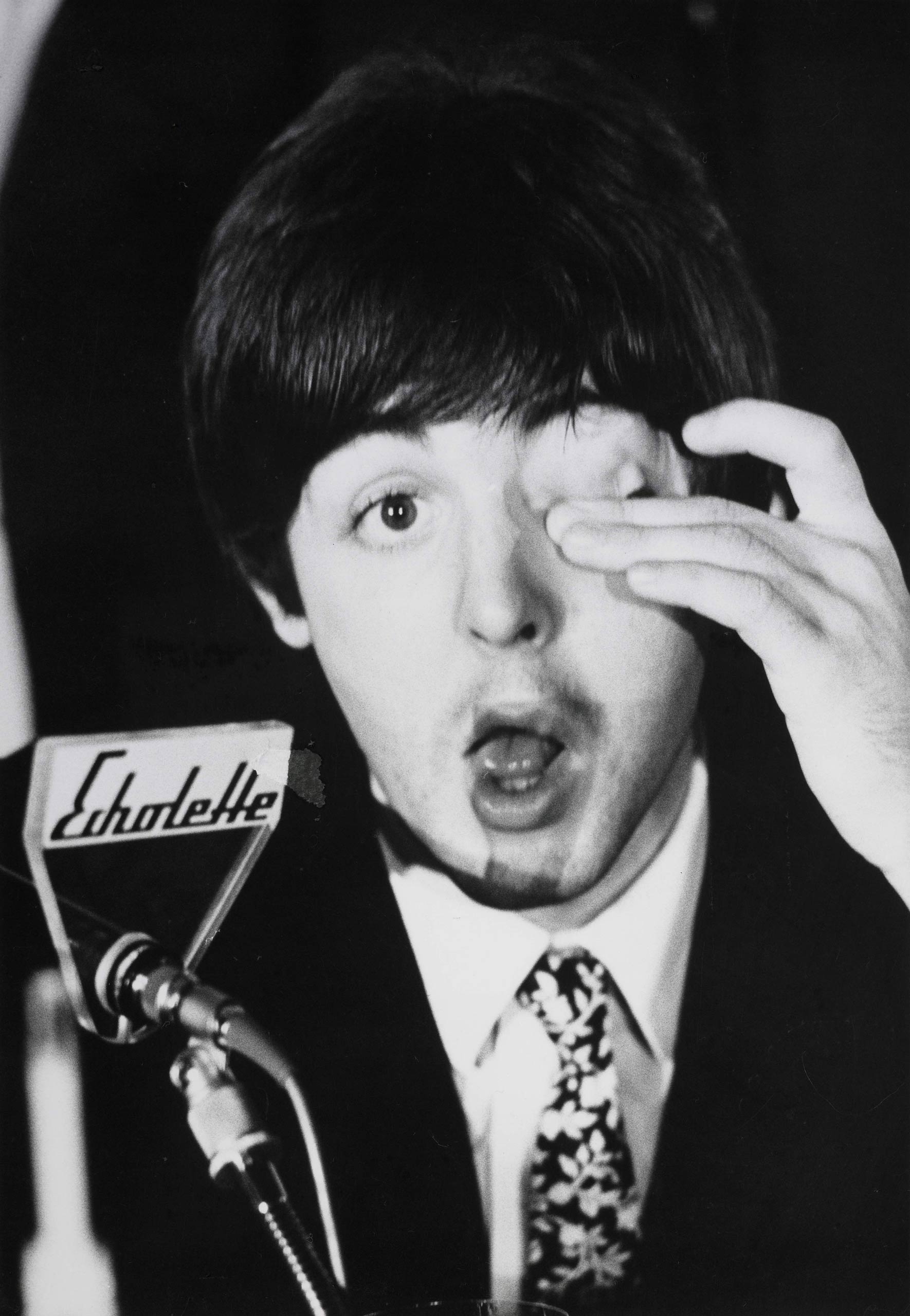 Paul McCartney poses at a press conference in Germany.