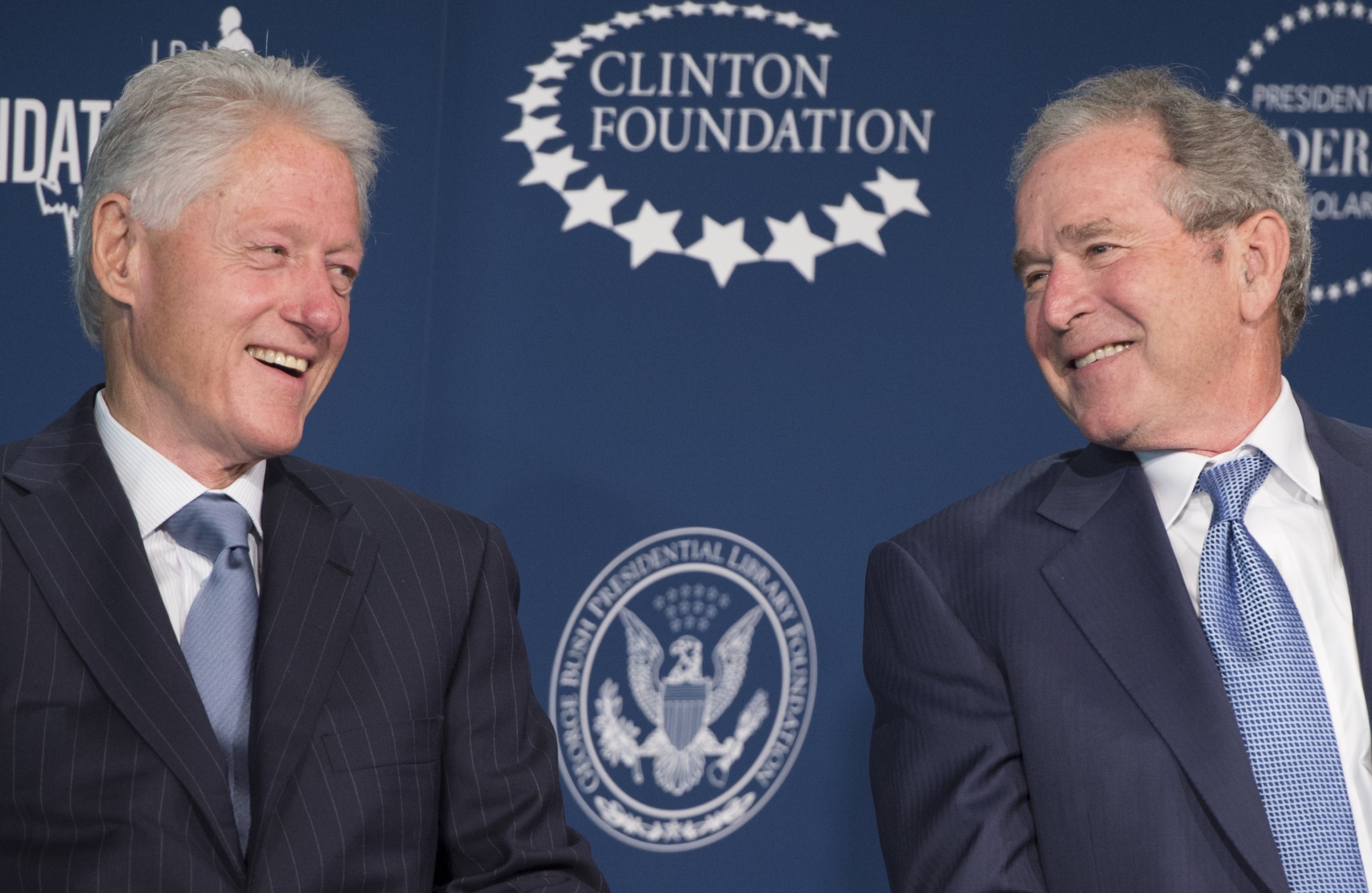 Former President Bill Clinton and former President George W. Bush speak during the launch of the Presidential Leadership Scholars Program at the Newseum in Washington on Sept. 8, 2014.