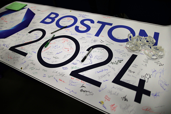 Signatures of support for Boston 2024 cover a banner on the table at a grassroots campaign in Boston on March 14, 2015.