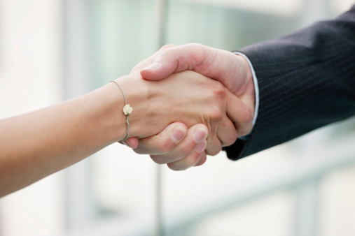 businesswoman-businessman-handshake