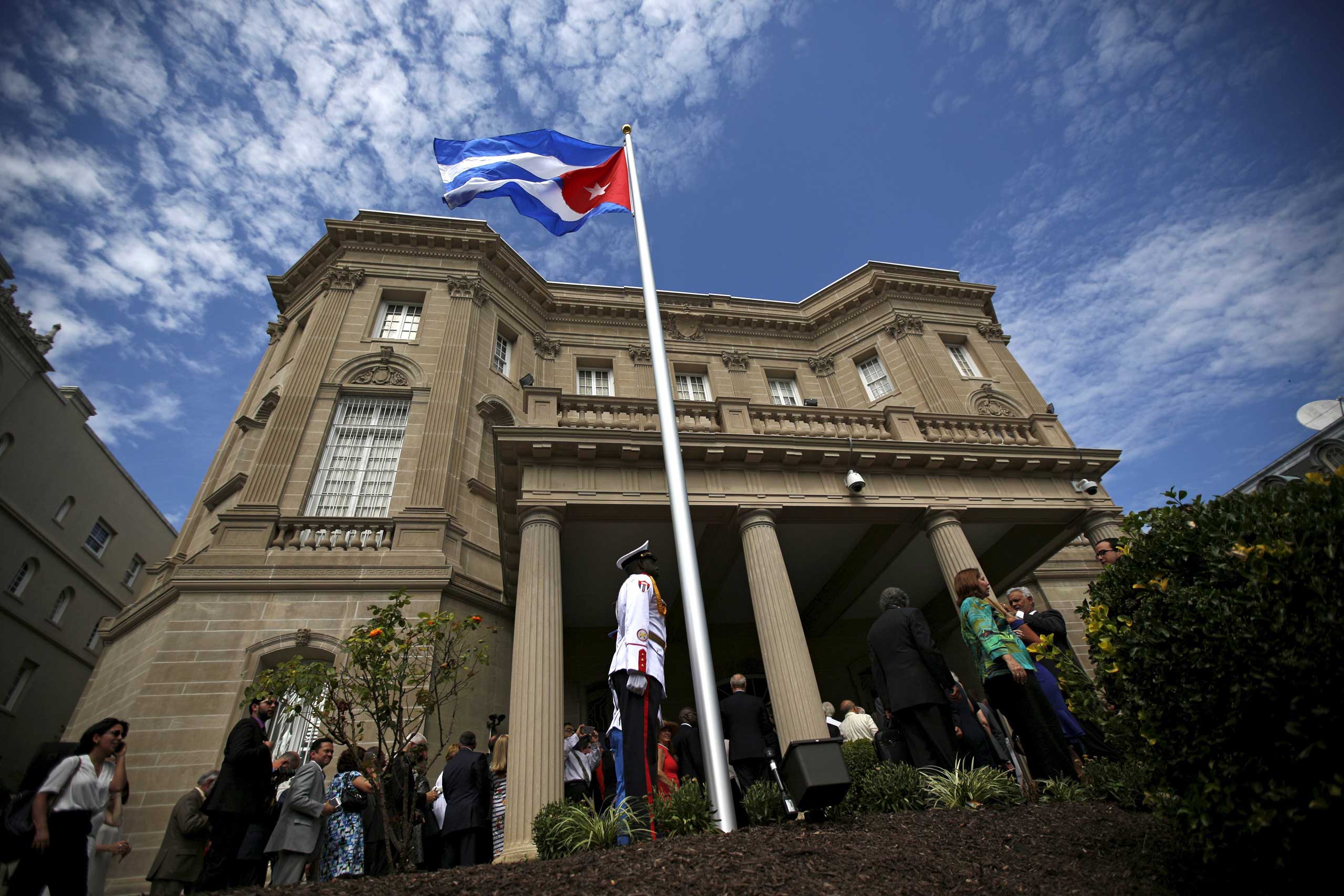A guard stands in front of the new Cuban embassy after officials raised the national flag in a ceremony in Washington on July 20, 2015.