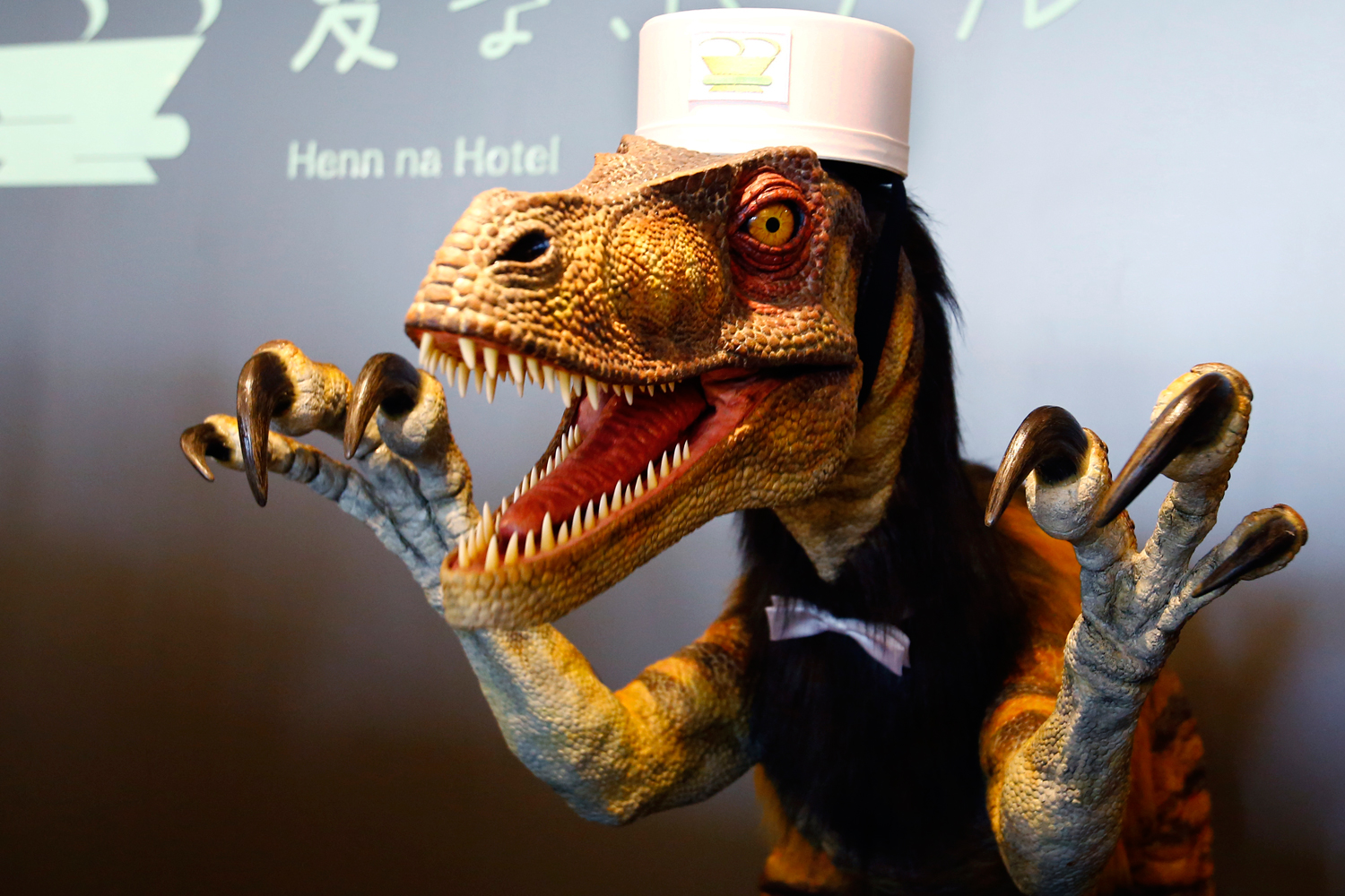 A receptionist dinosaur robot performs at the new robot hotel, aptly called Henn na Hotel or Weird Hotel, in Sasebo, southwestern Japan, July 15, 2015. (Shizuo Kambayashi—AP)