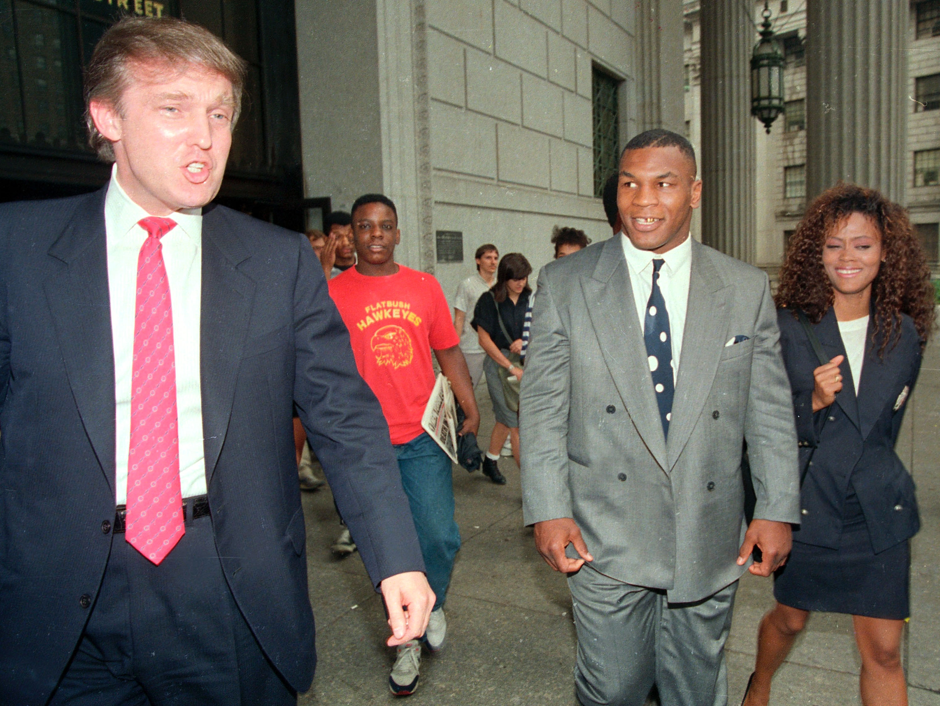 Heavyweight champion Mike Tyson, his wife, actress Robin Givens and Donald Trump, leave the New York State Supreme Court building on July 22, 1988.