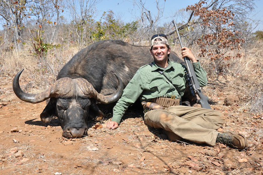 Donald Trump, Jr., posing with a buffalo in Zimbabwe during a safari trip in 2012.
