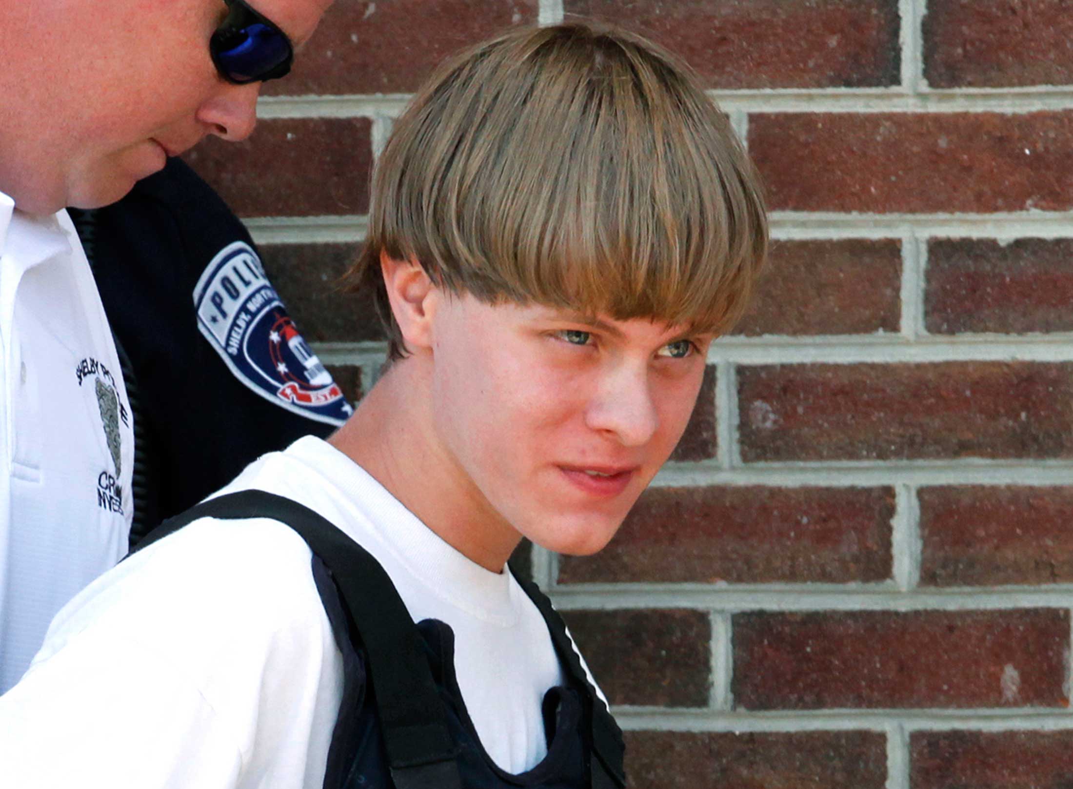 Police lead suspected shooter Dylann Roof into the courthouse in Shelby, North Carolina, June 18, 2015. (Jason Miczek — Reuters)