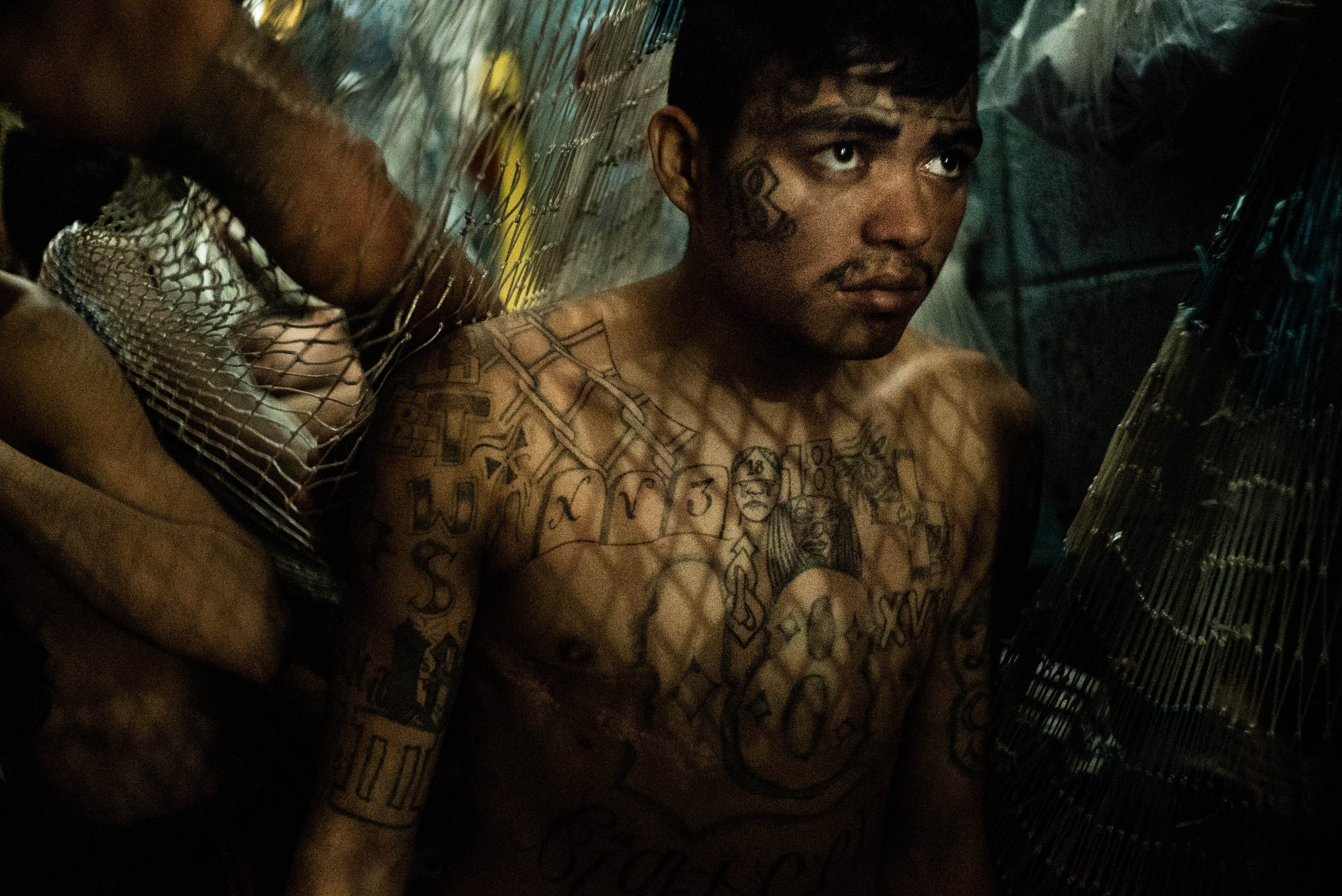A suspected gang member in a crowded jail in San Salvador. (Patrick Tombola—Laif)