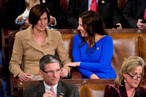 Reps. Elise Stefanik, R-N.Y., right, and Mimi Walters, R-Calif., are pictured during the election for Speaker before the 114th Congress was sworn in on the House floor, January 6, 2015.