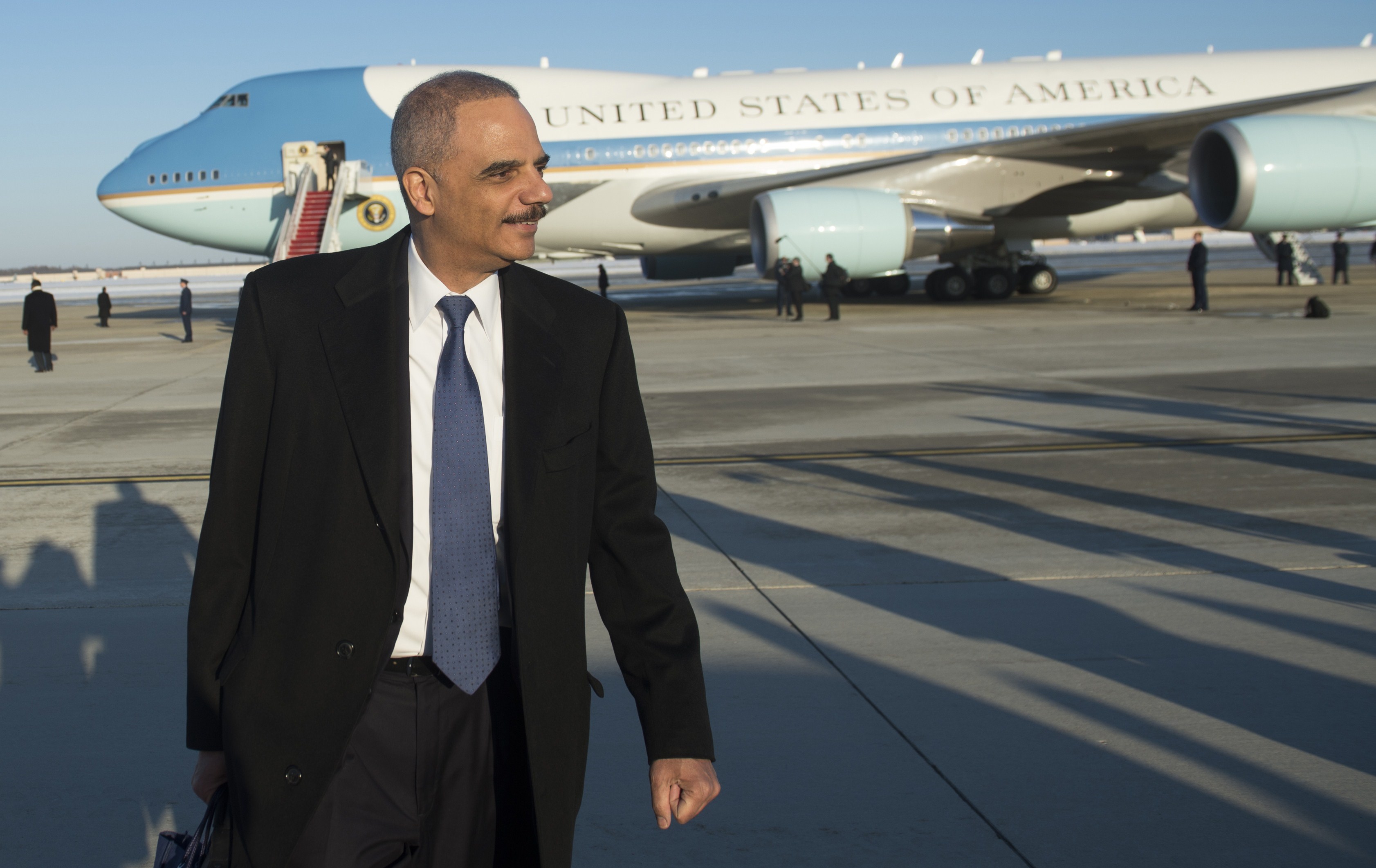 Attorney General Eric Holder walks from Air Force One after arriving with US President Barack Obama at Andrews Air Force Base in Maryland, March 6, 2015. ((Saul Loeb—AFP/Getty Images))