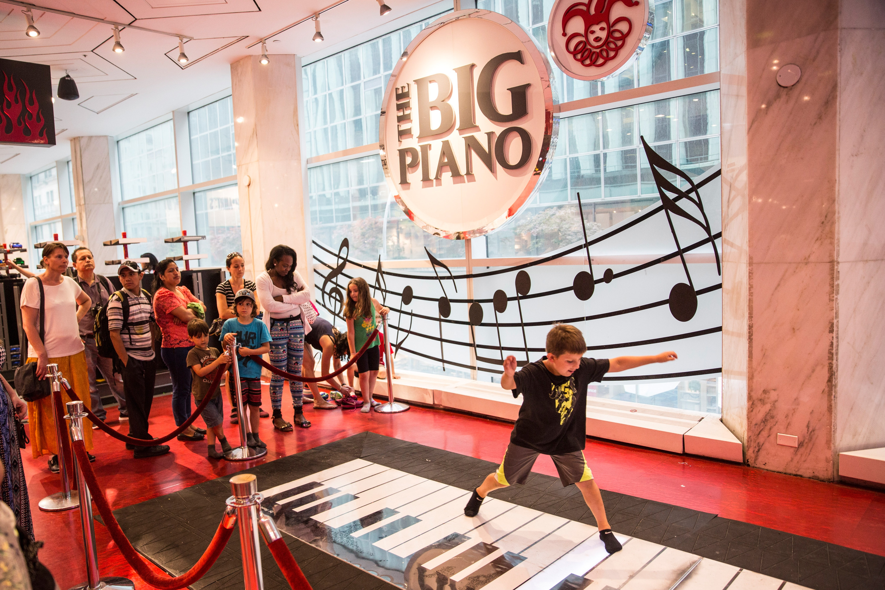 Children play on the "Big Piano," made famous by the movie Big, in FAO Schwarz toy store on July 14, 2015 in New York City. (Andrew Burton&mdash;Getty Images)