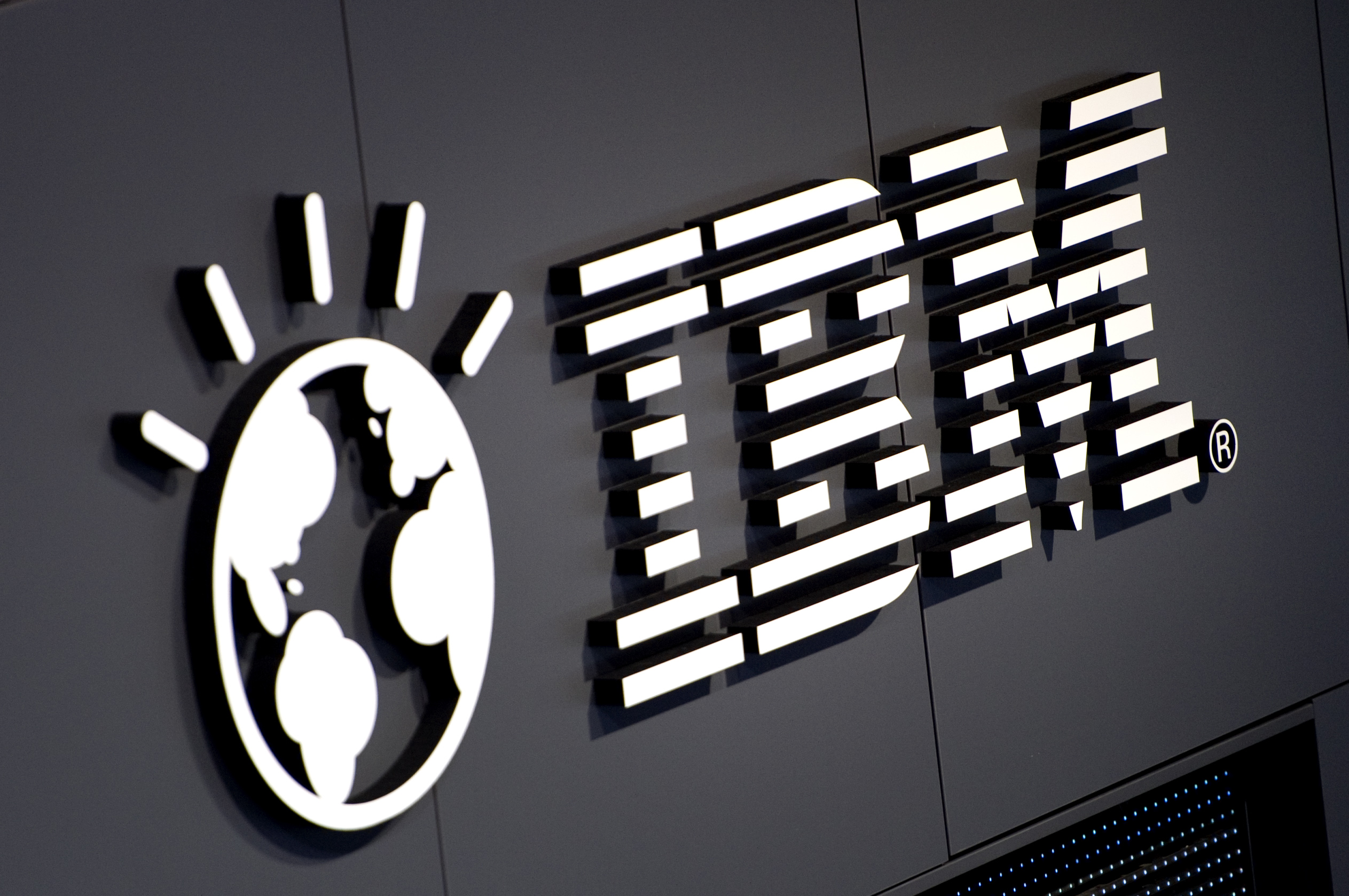 The logo of IBM is seen at their booth p