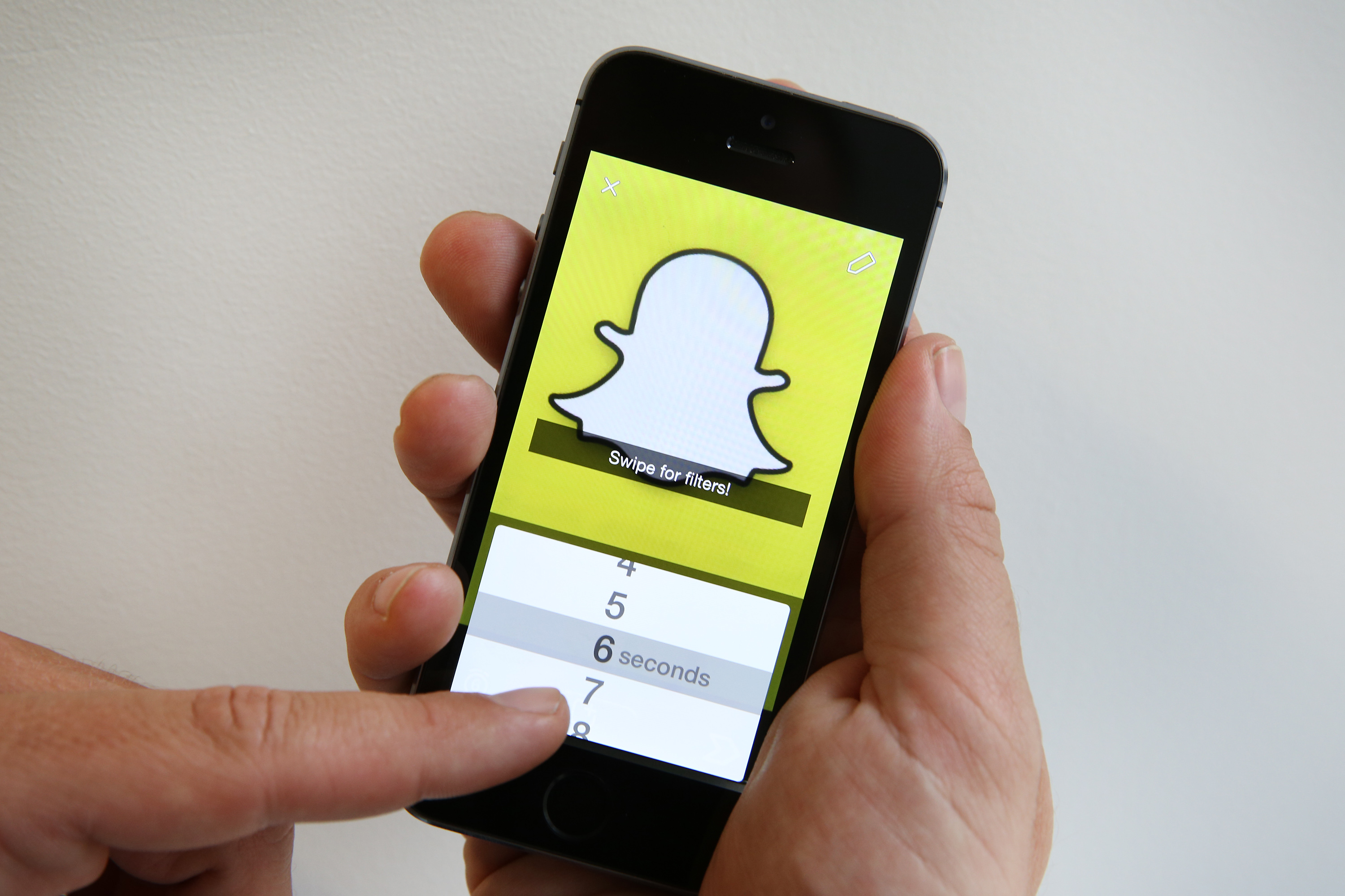 In this photo illustration the Snapchat app is used on an iPhone on October 6, 2014 in London, England. (Peter Macdiarmid&mdash;Getty Images)