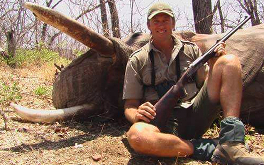 Glenn McGrath, Australian international cricketer, posing with an elephant in Zimbabwe during a safari trip in 2008.