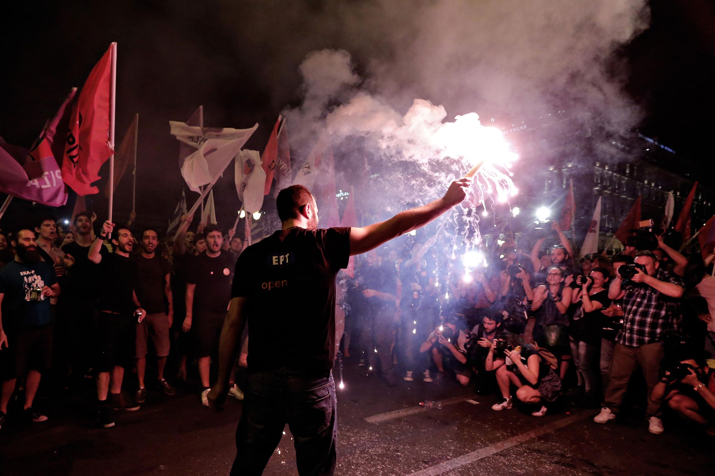 "No" supporters celebrate the referendum results on a street in central in Athens.