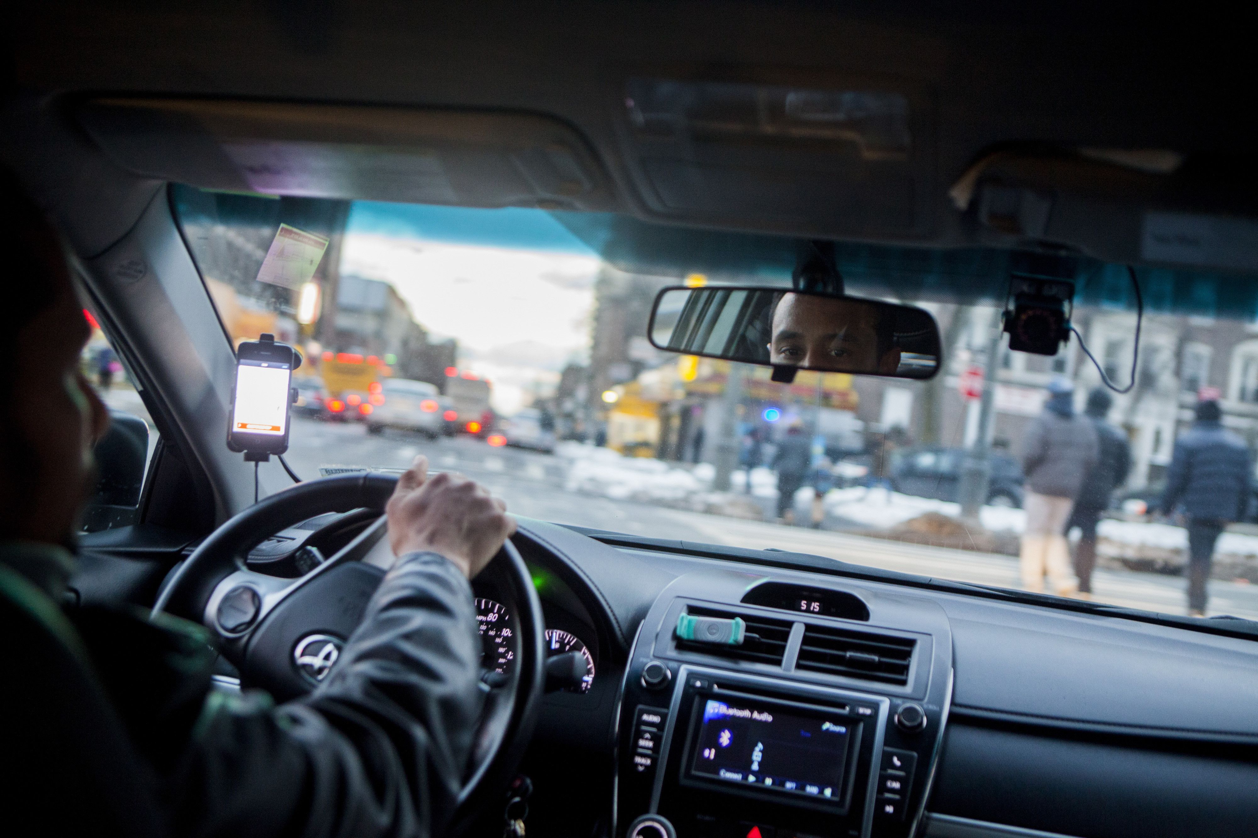 An Uber driver navigates the streets of Brooklyn?s Crown Heights neighborhood.