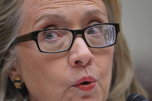 US Secretary of State Hillary Clinton can be seen wearing special glasses while testifying before the House Foreign Affairs Committee on January 23, 2013 in Washington, D.C. (MANDEL NGAN—AFP/Getty Images)