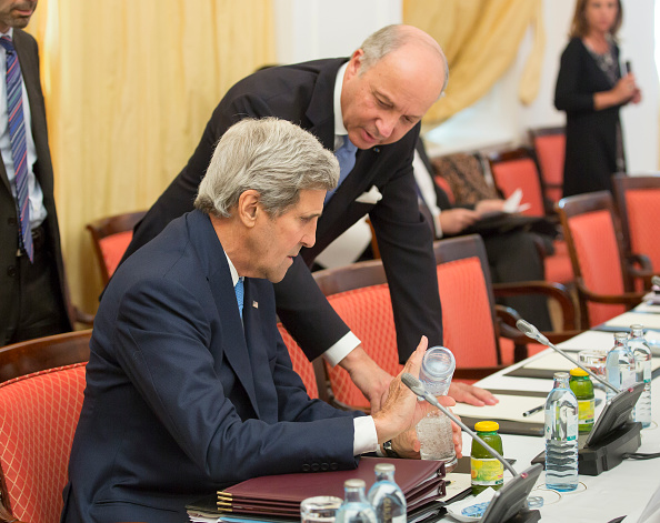 Foreign Minister of France Laurent Fabius (R) talks with U.S. Secretary of State John Kerry during the nuclear talks between the E3+3 (France, Germany, UK, China, Russia, US) and Iran in Vienna, Austria on July 06, 2015.