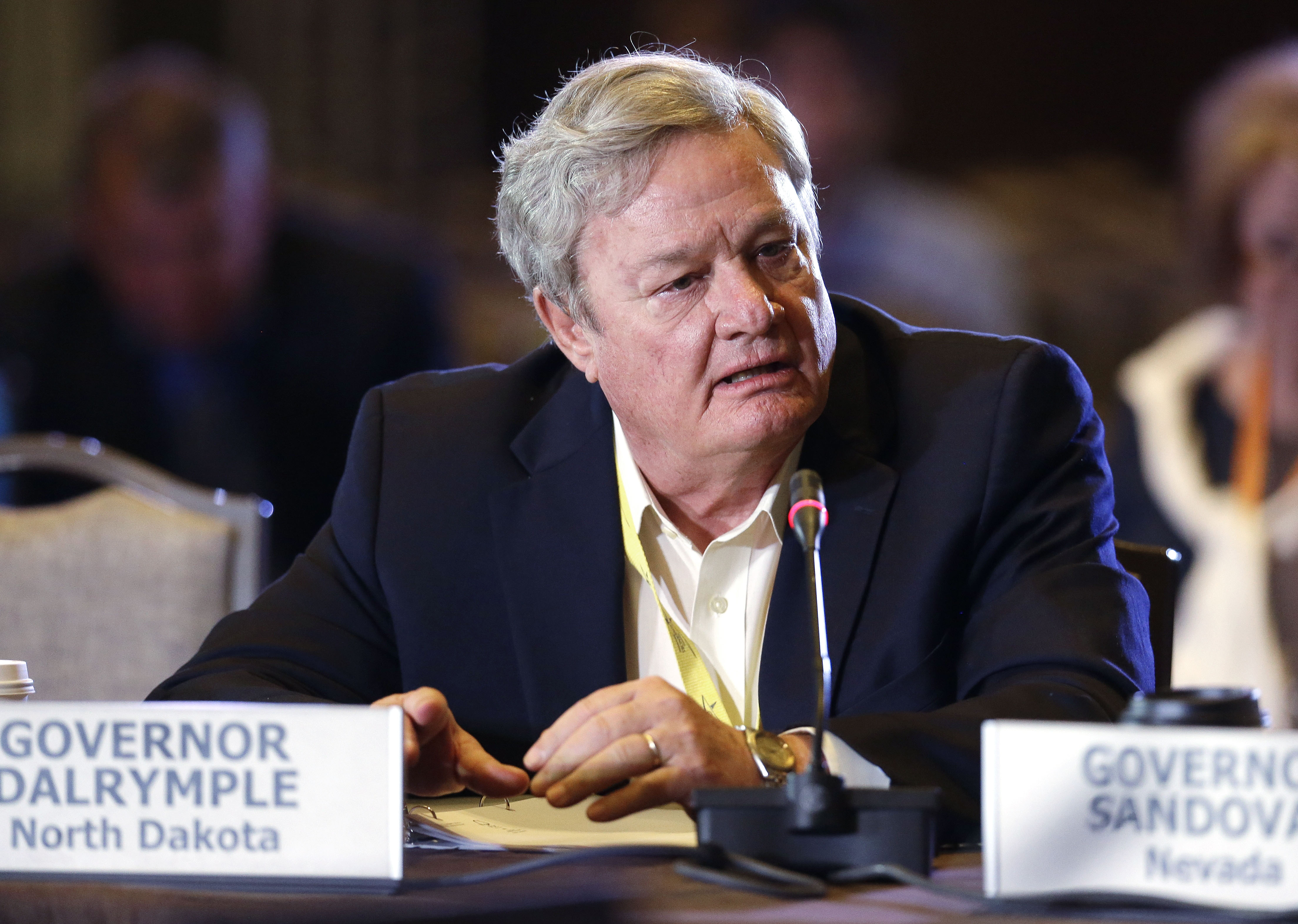 North Dakota Gov. Jack Dalrymple asks a question during a meeting of the Health and Human Services Committee at the National Governors Association convention on July 12, 2014, in Nashville, Tenn. (Mark Humphrey—AP)