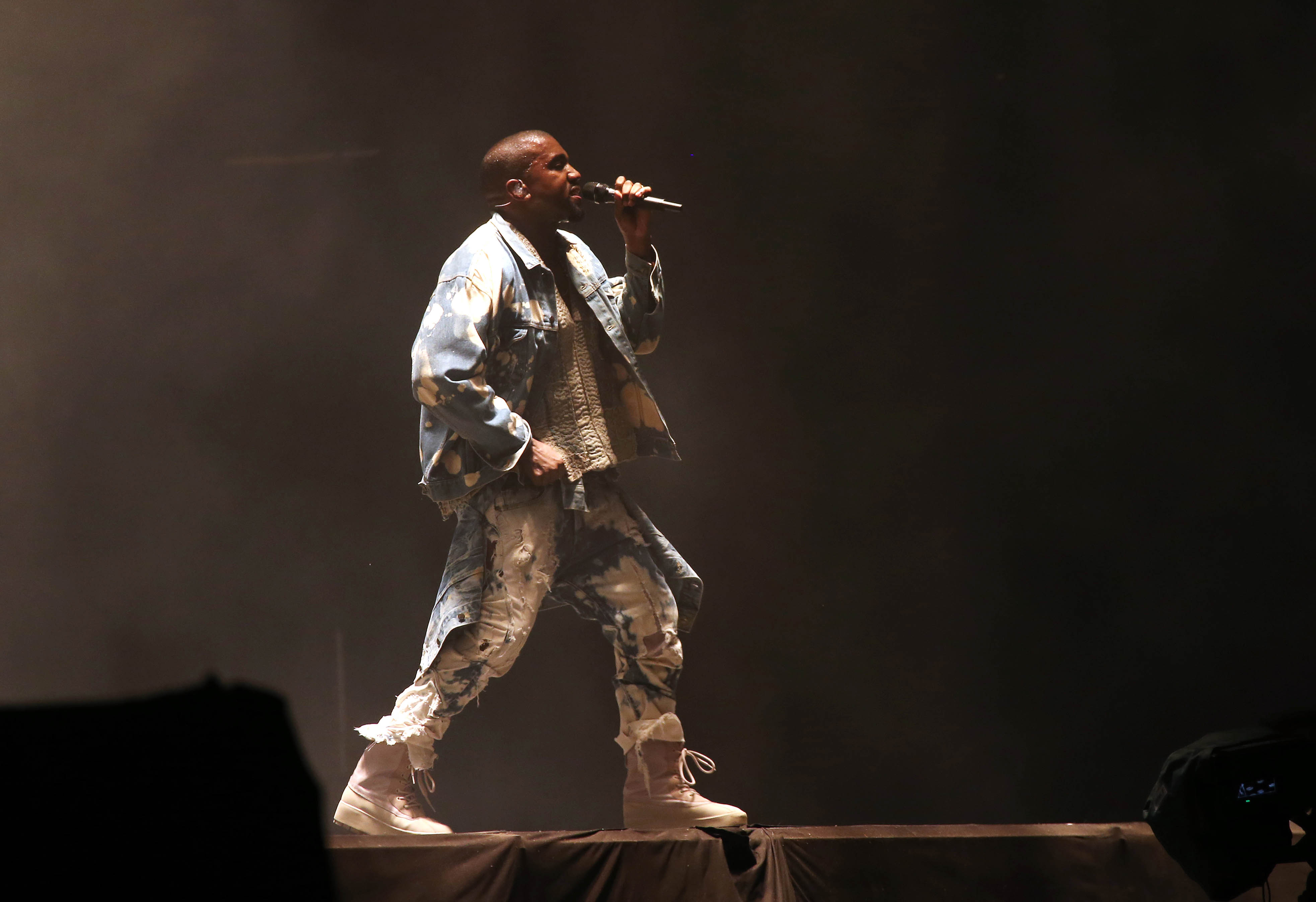 Kanye West performs during the 2015 Glastonbury music festival. (Joel Ryan—Invision/AP)