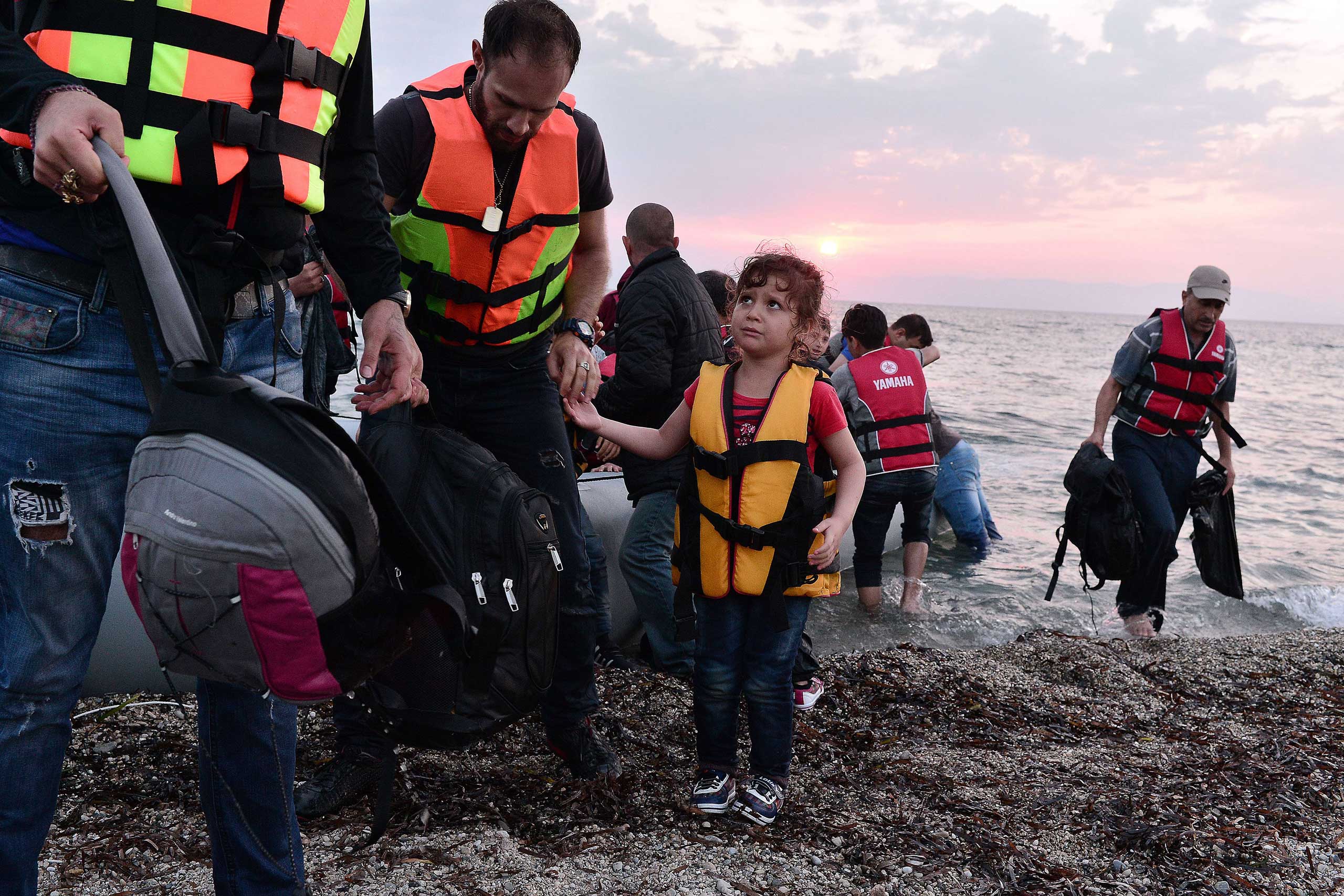 Syrians disembark on the island of Lesbos, Greece, early on June 18, 2015. (Louisa Gouliamaki—AFP/Getty Images)
