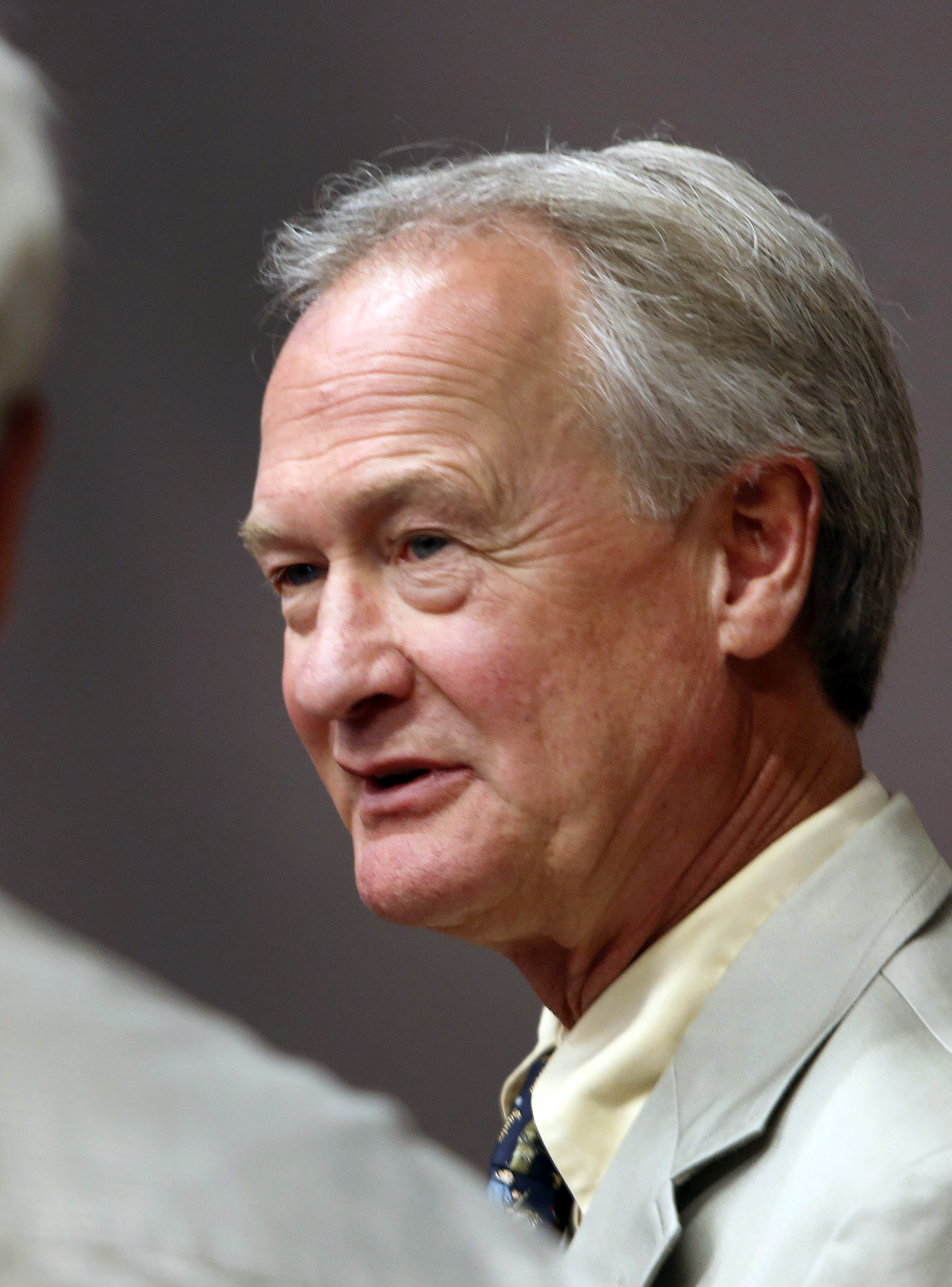 Democratic presidential candidate former Rhode Island Gov. Lincoln Chafee meets with voters during a campaign stop in Laconia, N.H. (Jim Cole—AP)