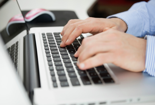 man-hands-typing-laptop-keyboard