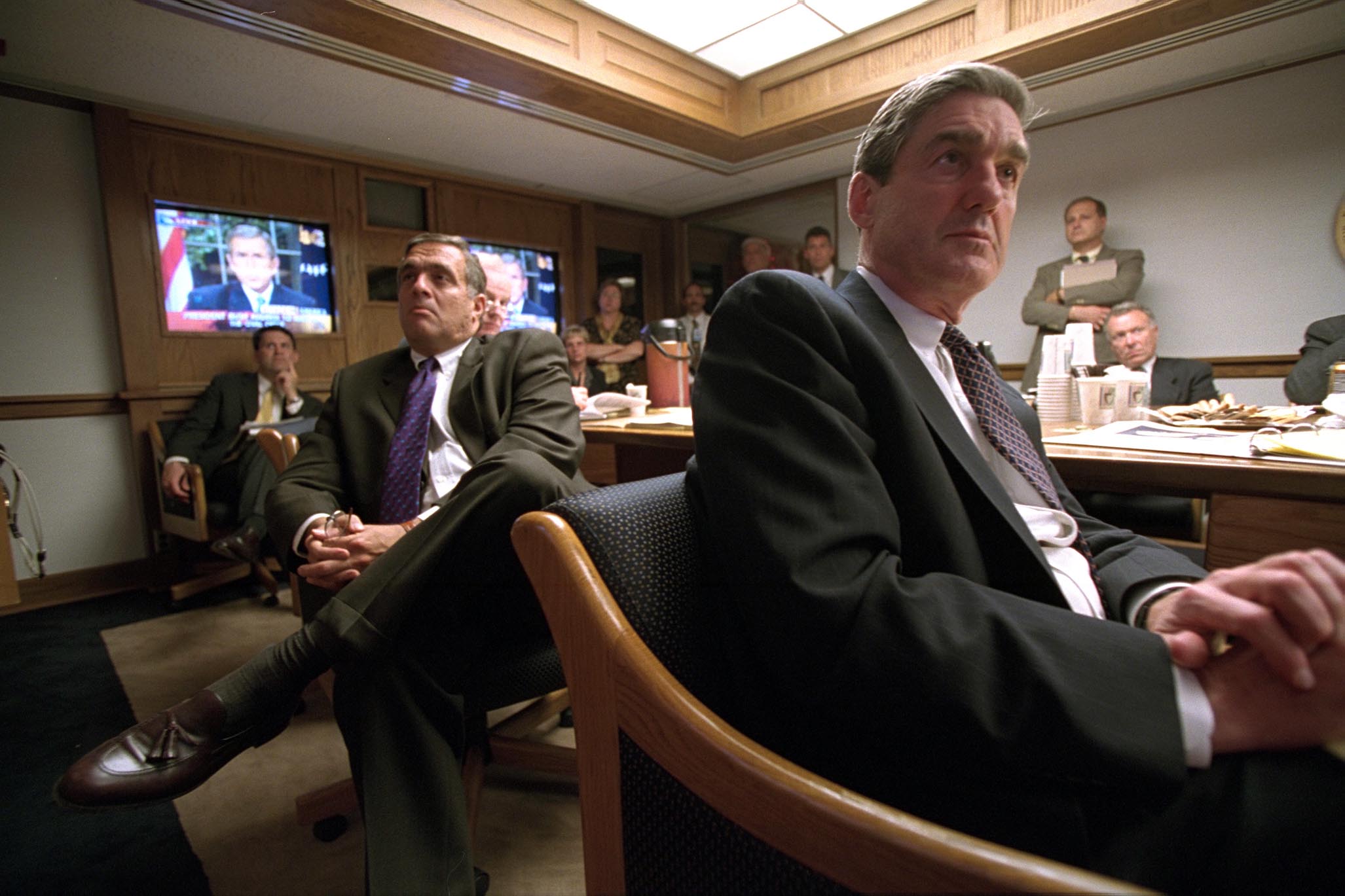 CIA Director George Tenet, left, listens to President Bush's address in the President's Emergency Operations Center