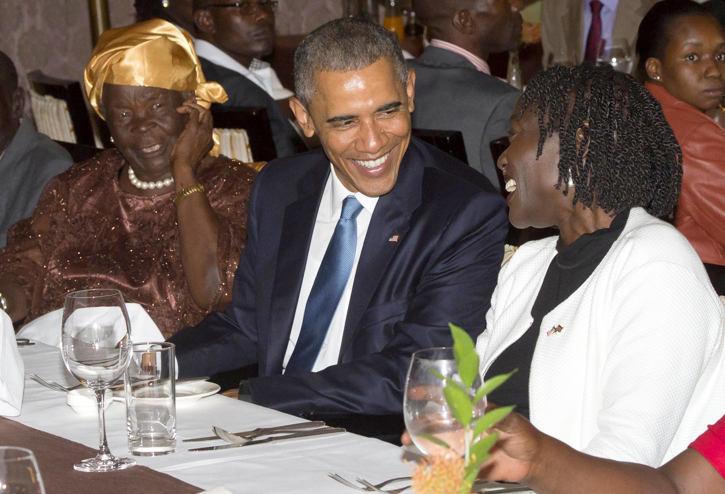 US President Barack Obama sits alongside his step-grandmother, Mama Sarah, left, and half-sister Auma Obama, right, during a gathering of family at his hotel in Nairobi on July 24, 2015. (Saul Loeb—AFP/Getty Images)