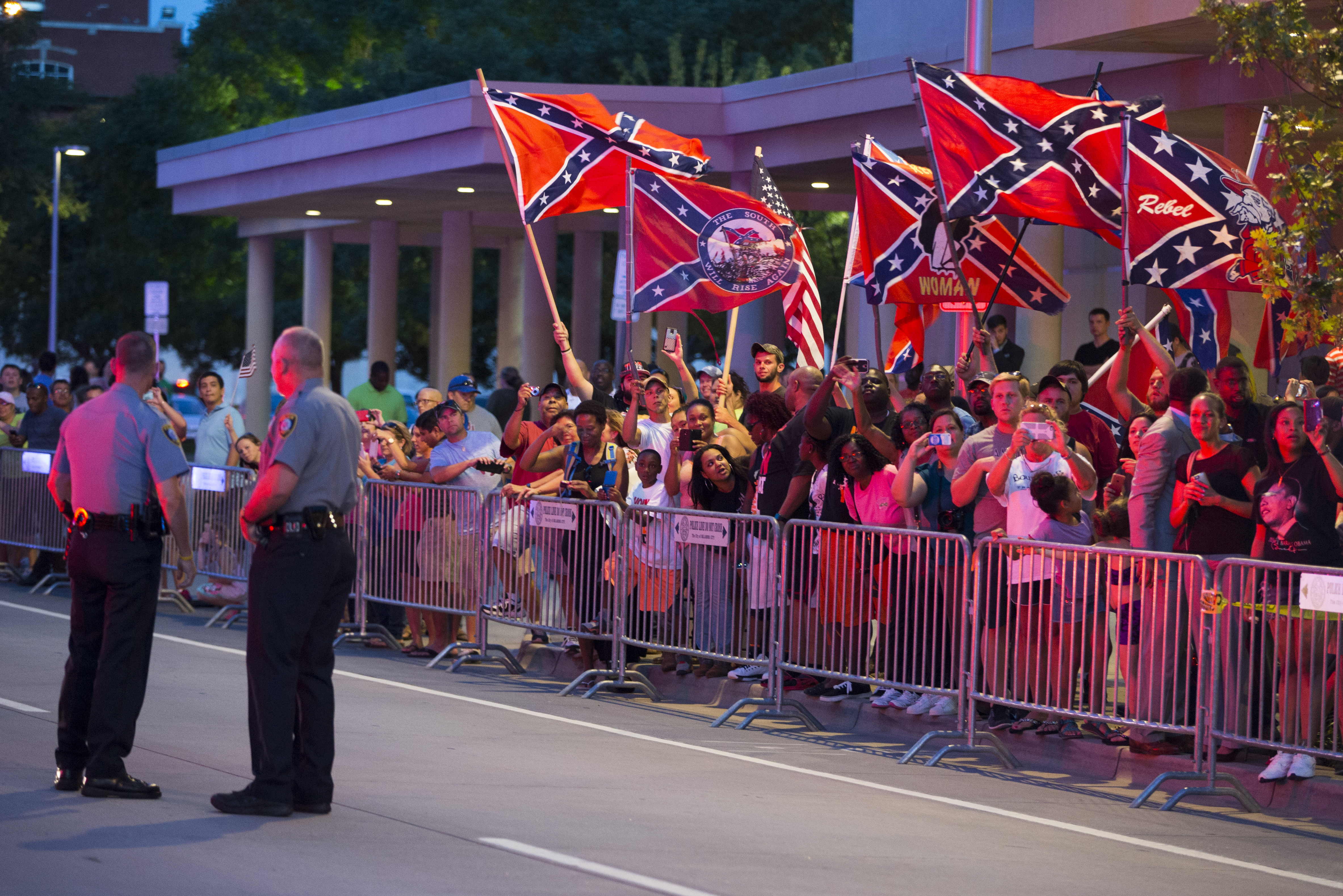 People wave Confederate flags outside the hotel where President Barack Obama is staying on July 15, 2015, in Oklahoma City. (Evan Vucci—AP)