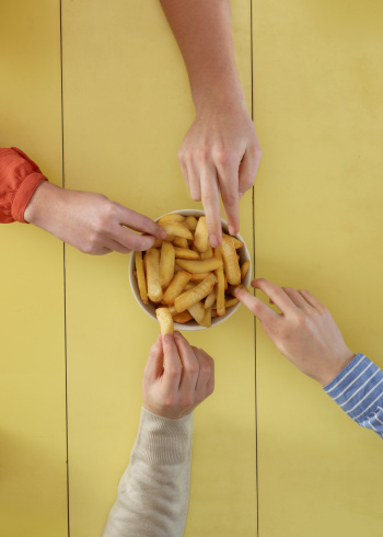 overhead-view-people-sharing-fries