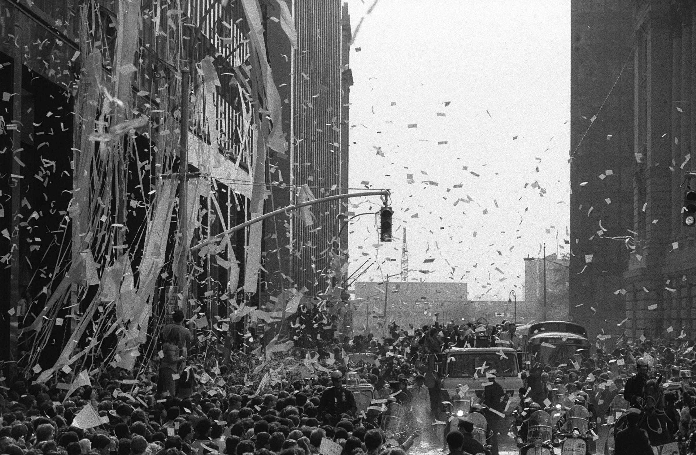 The New York Yankees ride in a motorcade of a ticker tape parade in lower Manhattan on October 19, 1978. New York City welcomed the team home as champions of the 75th World Series.