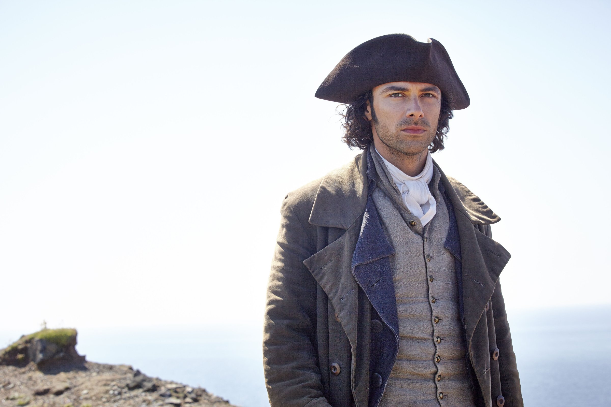 PoldarkSundays, June 21 - August 2, 2015 on MASTERPIECE on PBSRoss Poldark rides again in a swashbuckling newÊadaptation of the hit series that helped launch MASTERPIECE in theÊ1970s. AidanÊTurner (The Hobbit) stars as Captain Poldark, a redcoat who returns toÊCornwall after the AmericanÊRevolution and finds that his fighting days are farÊfrom over. Robin Ellis, who played Poldark in the 1970s PBS adaptation,Êappears inÊthe role of Reverend Halse. Eleanor Tomlinson (MASTERPIECE ÒDeath Comes to PemberleyÓ) plays the spunky Cornish minerÕsÊdaughter takenÊin by the gallant captain.ÊShown: Aidan Turner as Ross Poldark(C) Robert Viglasky/Mammoth Screen for MASTERPIECEThis image may be used only in the direct promotion of MASTERPIECE. No other rights are granted. All rights are reserved. Editorial use only.