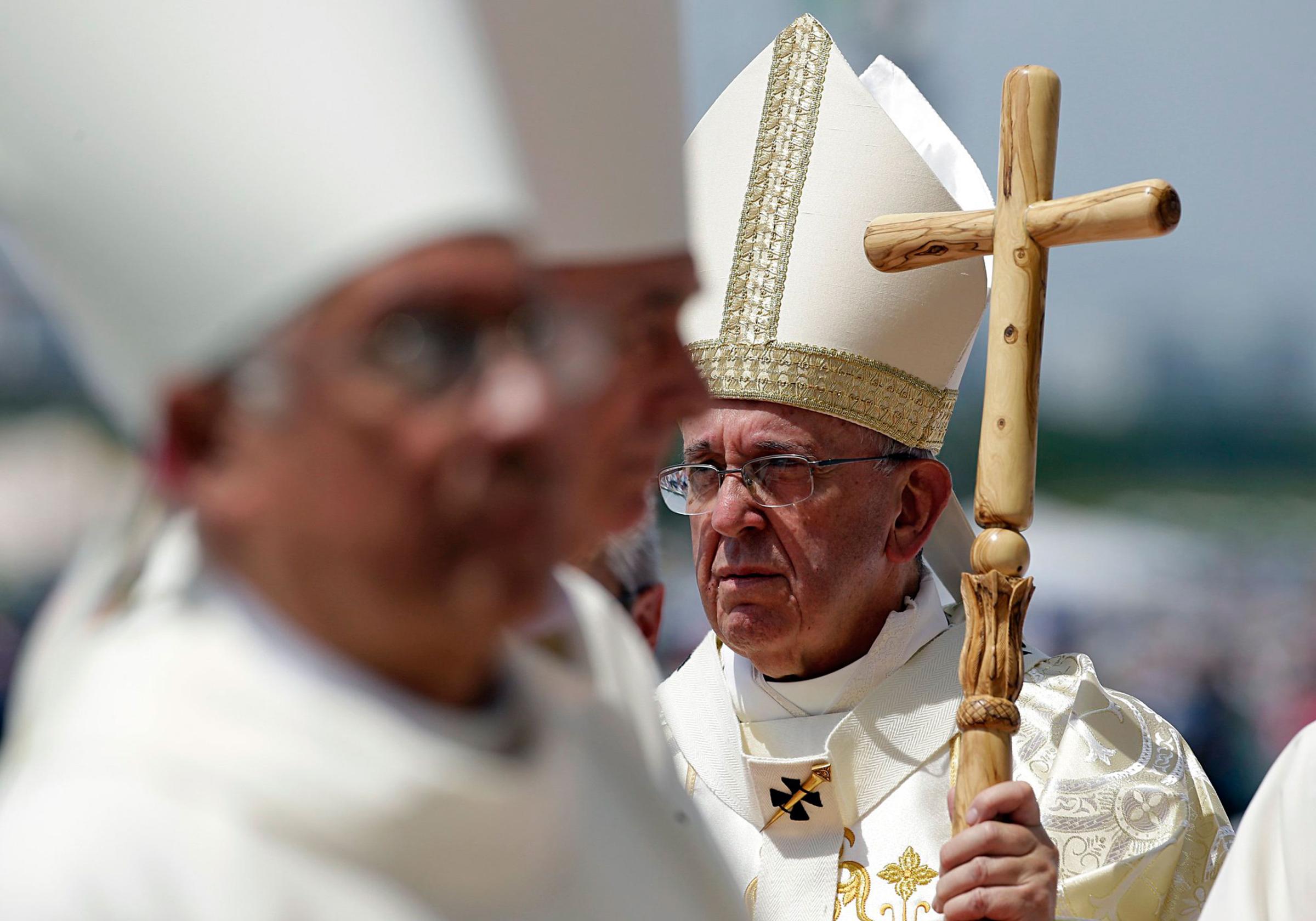 Pope Francis walks with his pastoral staff to celebrate a Mass in Guayaquil, Ecuador, Monday, July 6, 2015. Latin America's first pope arrived in this port city on Monday for the first big event of a three-nation tour where he's set compassion for the weak and respect for the environment as central themes. (AP Photo/Gregorio Borgia)