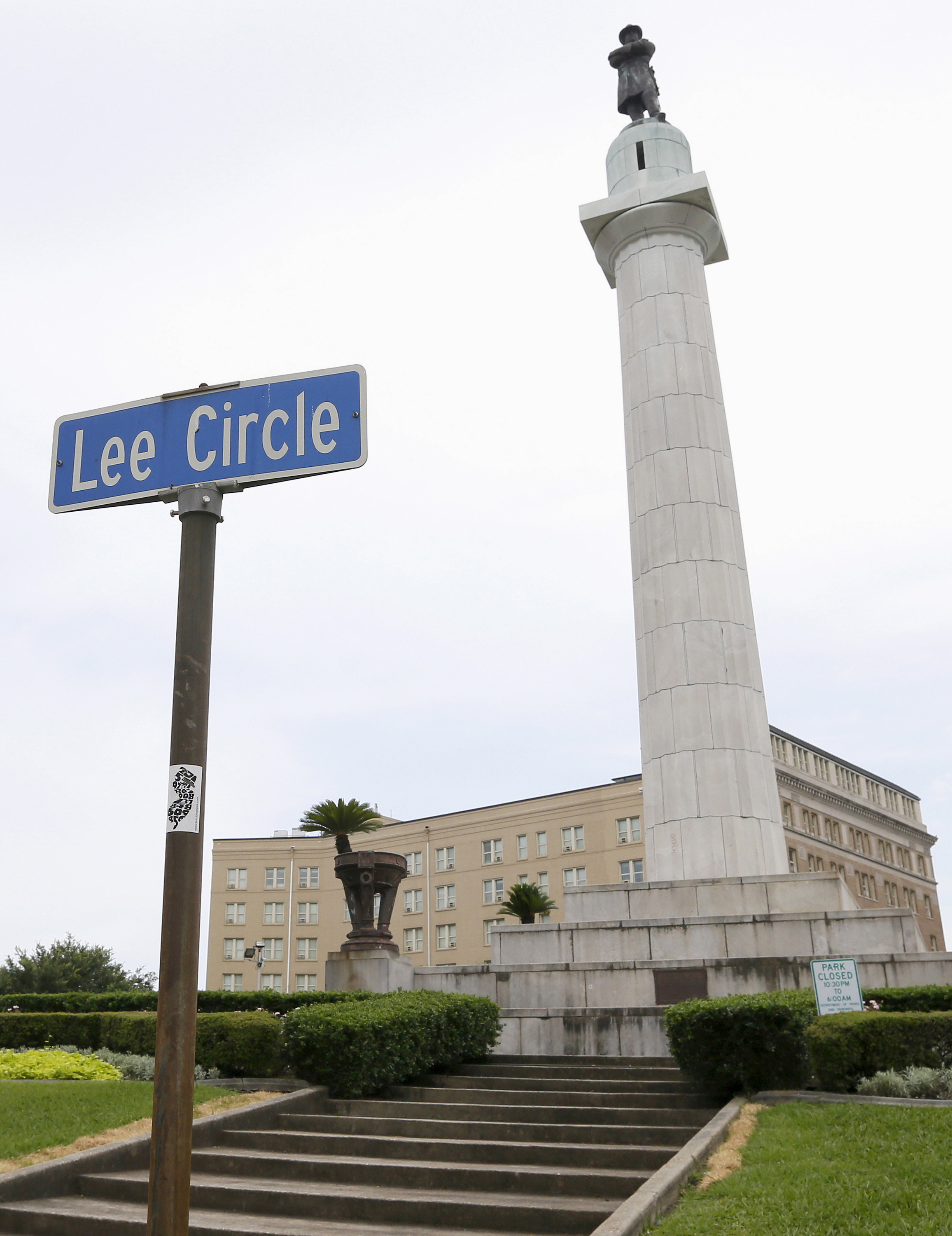 A monument to Confederate General Robert E. Lee towers over a traffic circle in New Orleans