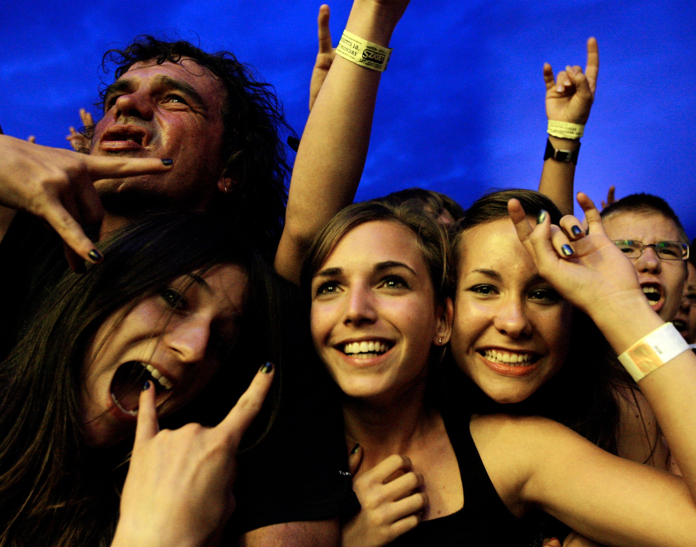 Revellers attend a concert by Hungarian metal band "Tankcsapda" during Budapest's one-week, round-the-clock Sziget ('Island') music festival