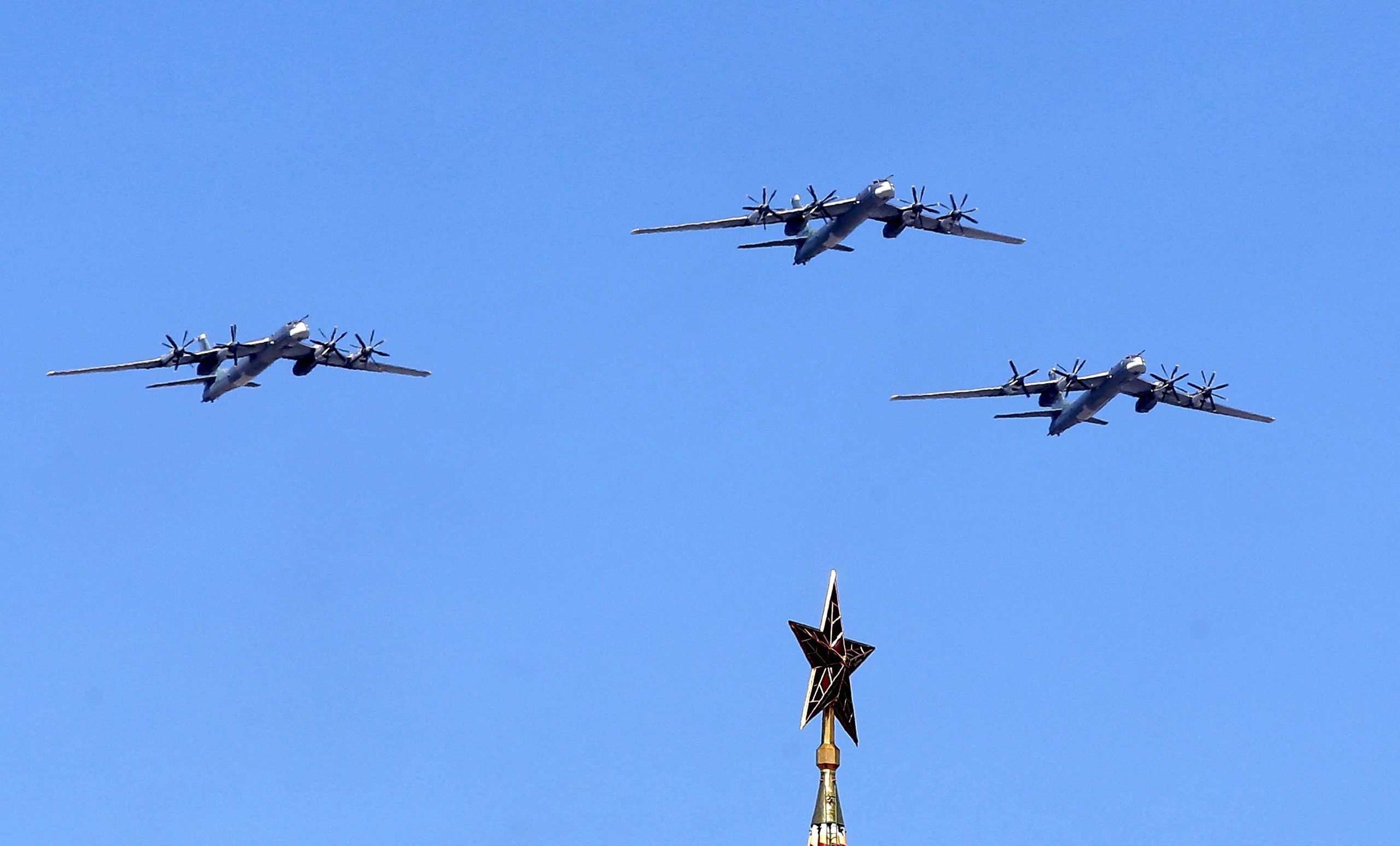 Russian TU-95 MS bombers and missile carriers above the Kremlin, during the rehearsal for the Victory Day military parade at the Red Square in Moscow, in May 2015. (Maxim Shipenkov—EPA)
