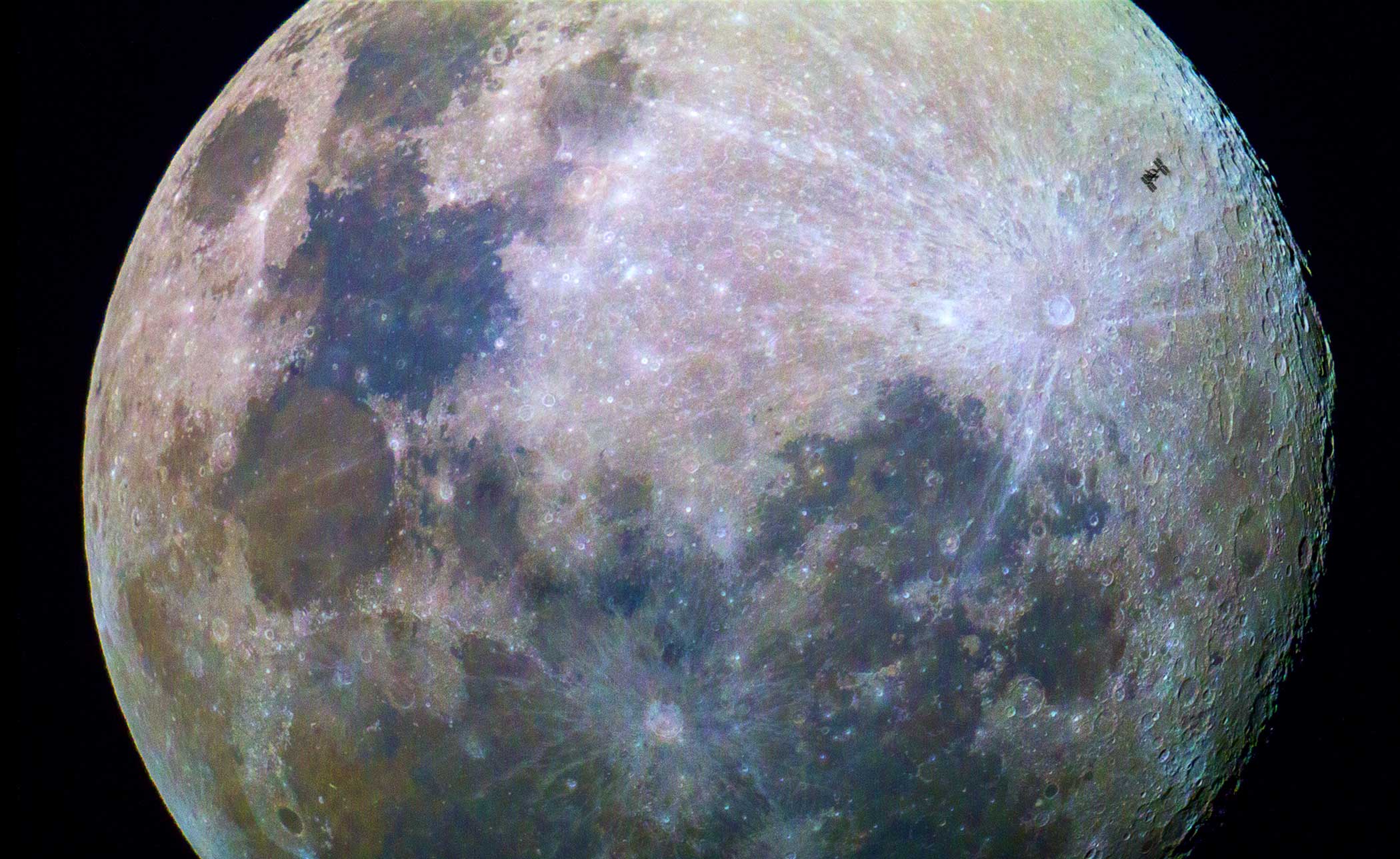 This image of the Moon was taken by amateur photographer Dylan O’Donnell as the International Space Station passed by at 28 800 km/h. At such speeds the weightless research laboratory was visible for only about a third of a second before returning to the dark skies. (Dylan O’Donnell)