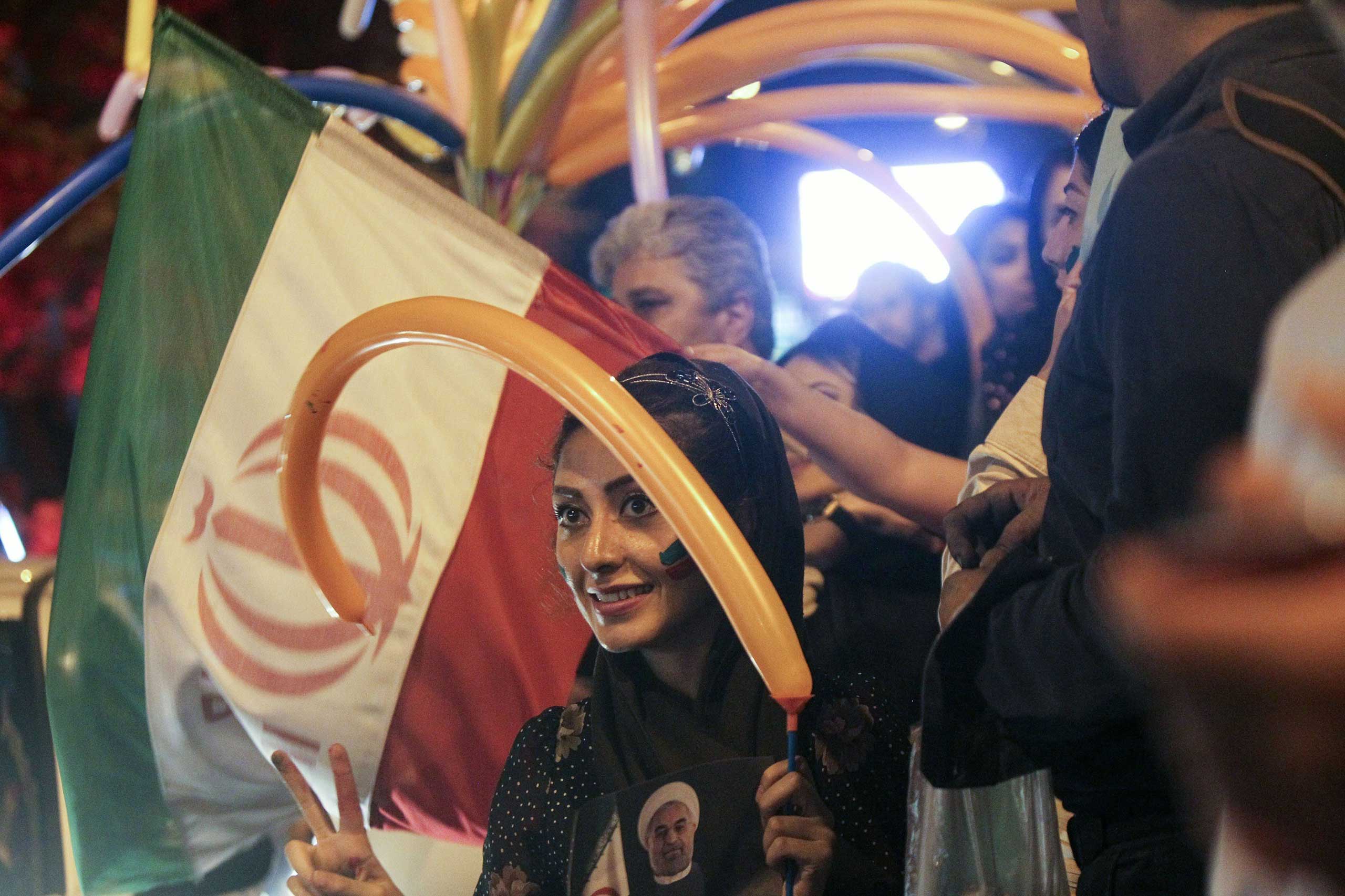 Iranians celebrate the nuclear agreement in Tehran on July 14, 2015. (Ahmad Halabisaz—Xinhua Press/Corbis)
