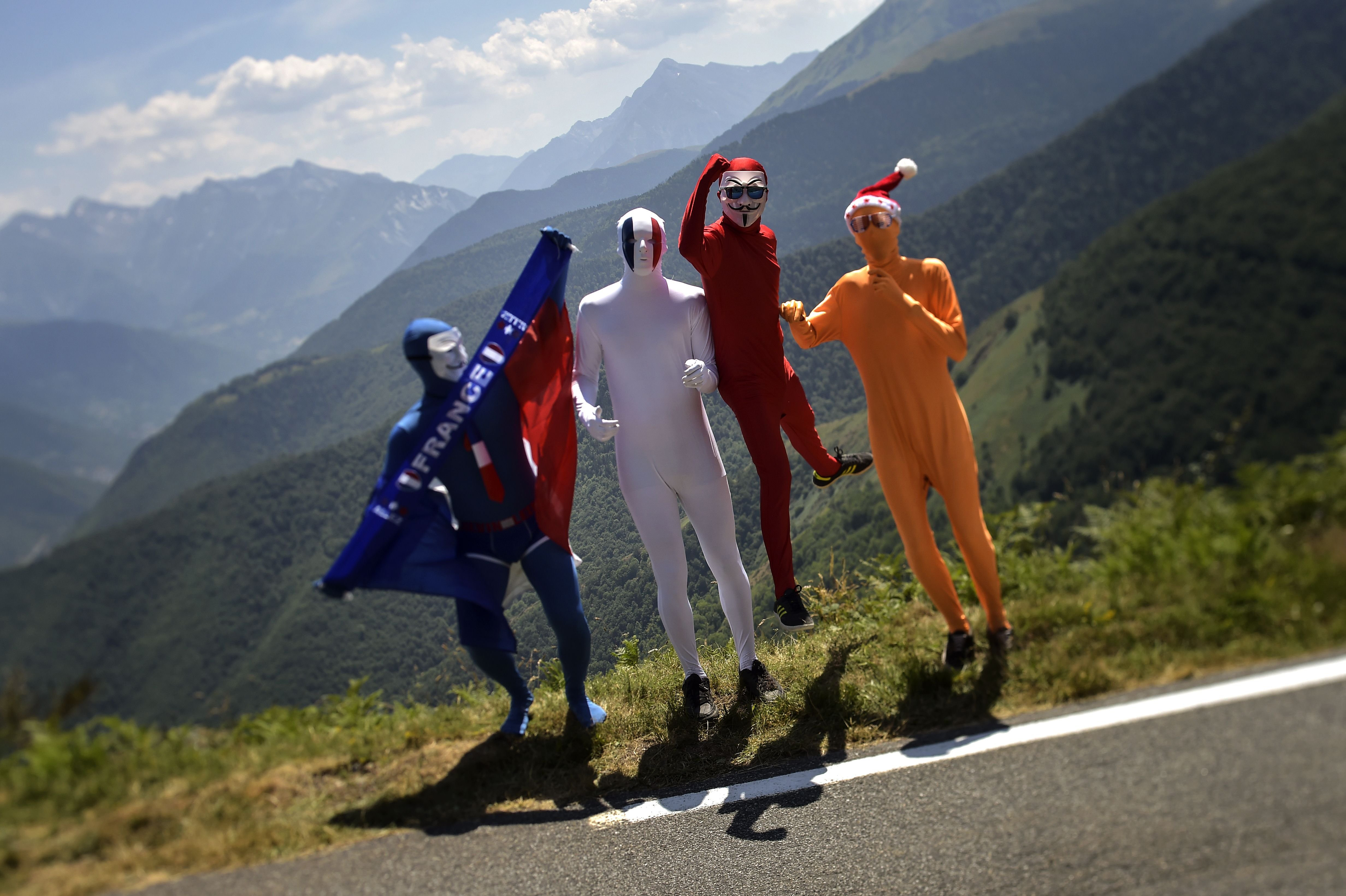 Disguised supporters wait along the road during the 11th stage of the race on July 15, 2015, between Pau and Cauterets, southwestern France.