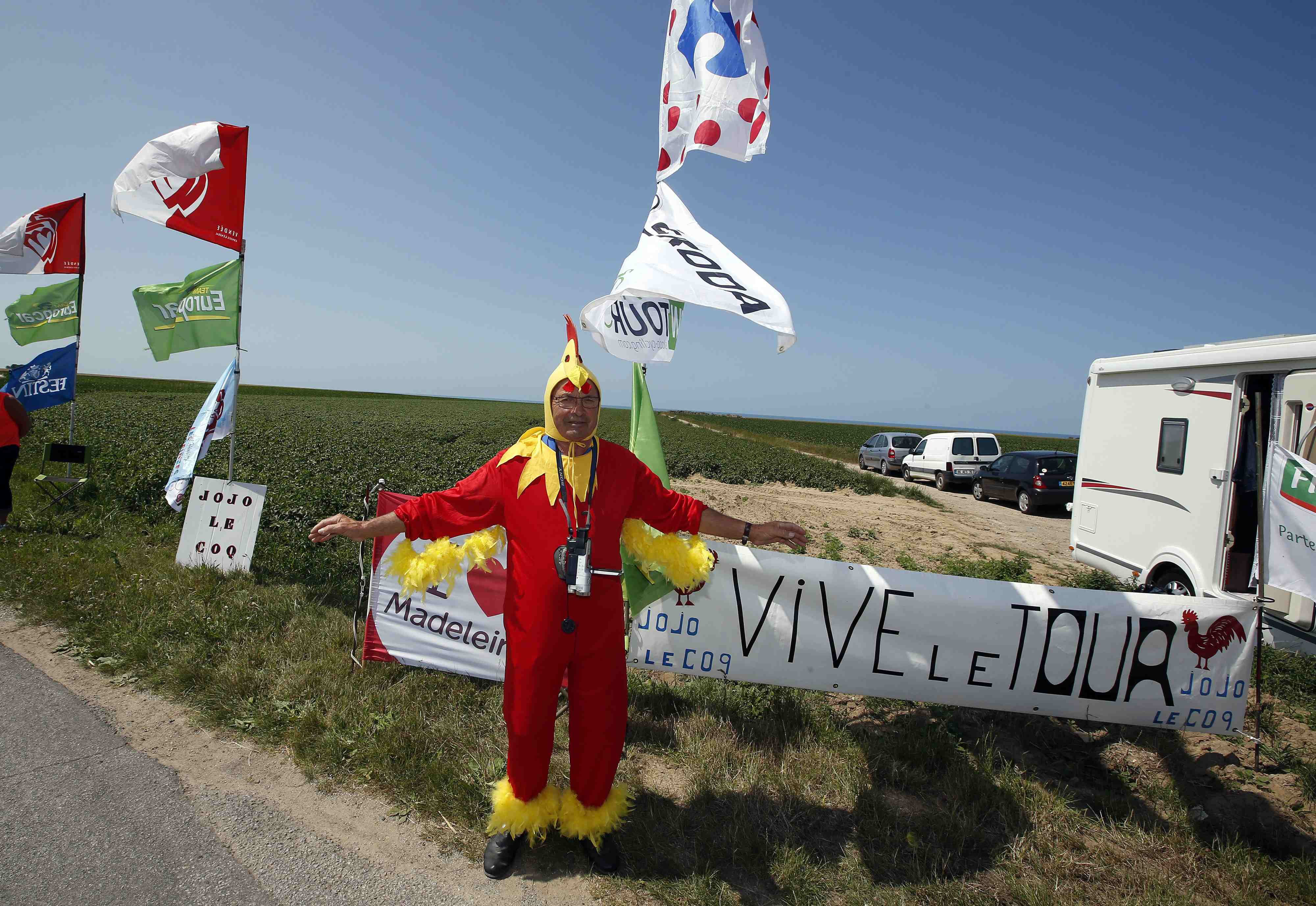French cyclist fan, Jojo the rooster, waits for the riders during the sixth stage of the race from Abbeville to Le Havre, France on July 9, 2015.