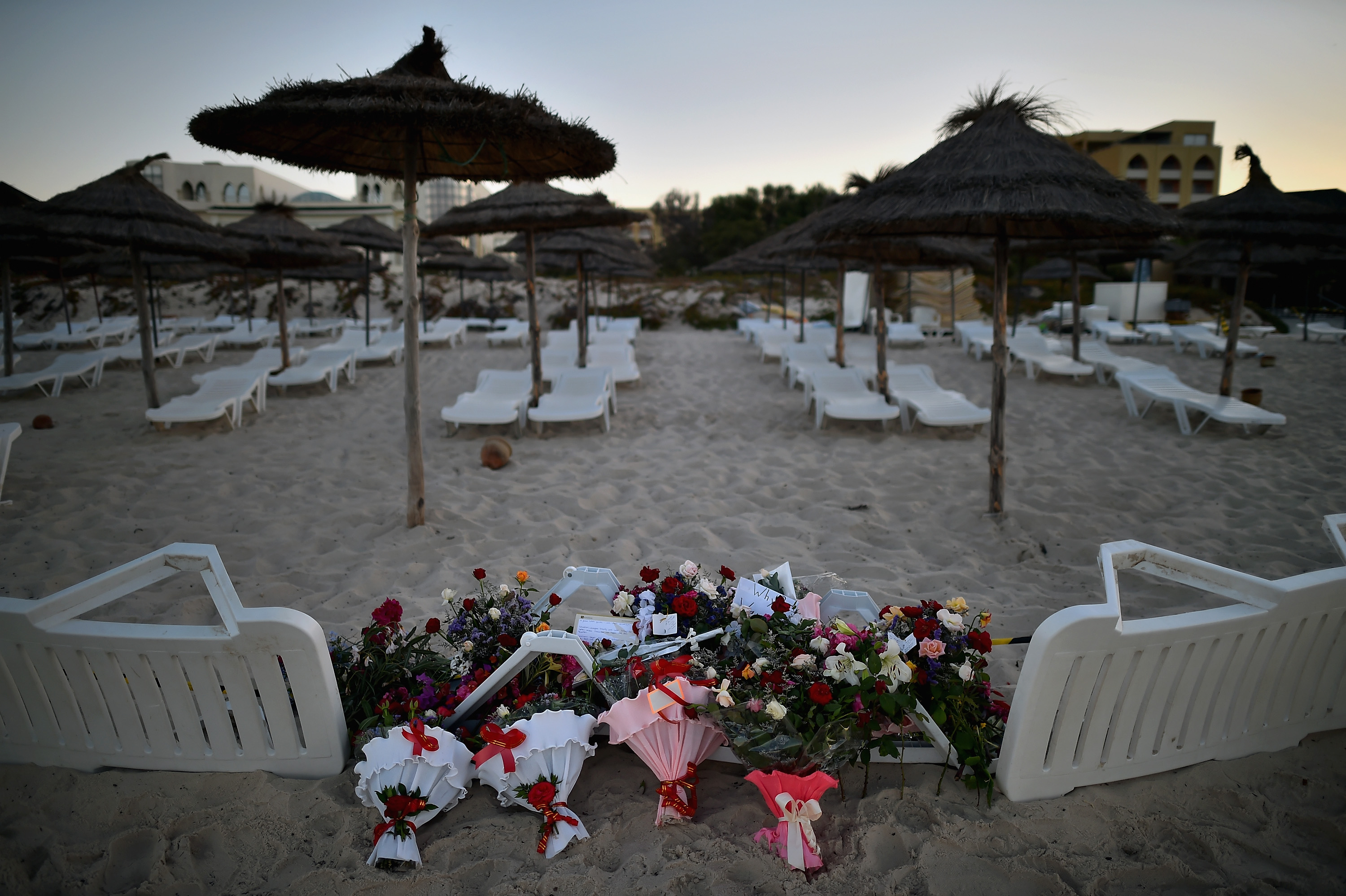 Flowers are placed on June 27, 2015, at the beach next to the Imperial Marhaba Hotel in Sousse, Tunisia, where 38 people were killed in a terrorist attack a day earlier (Jeff J Mitchell—Getty Images)