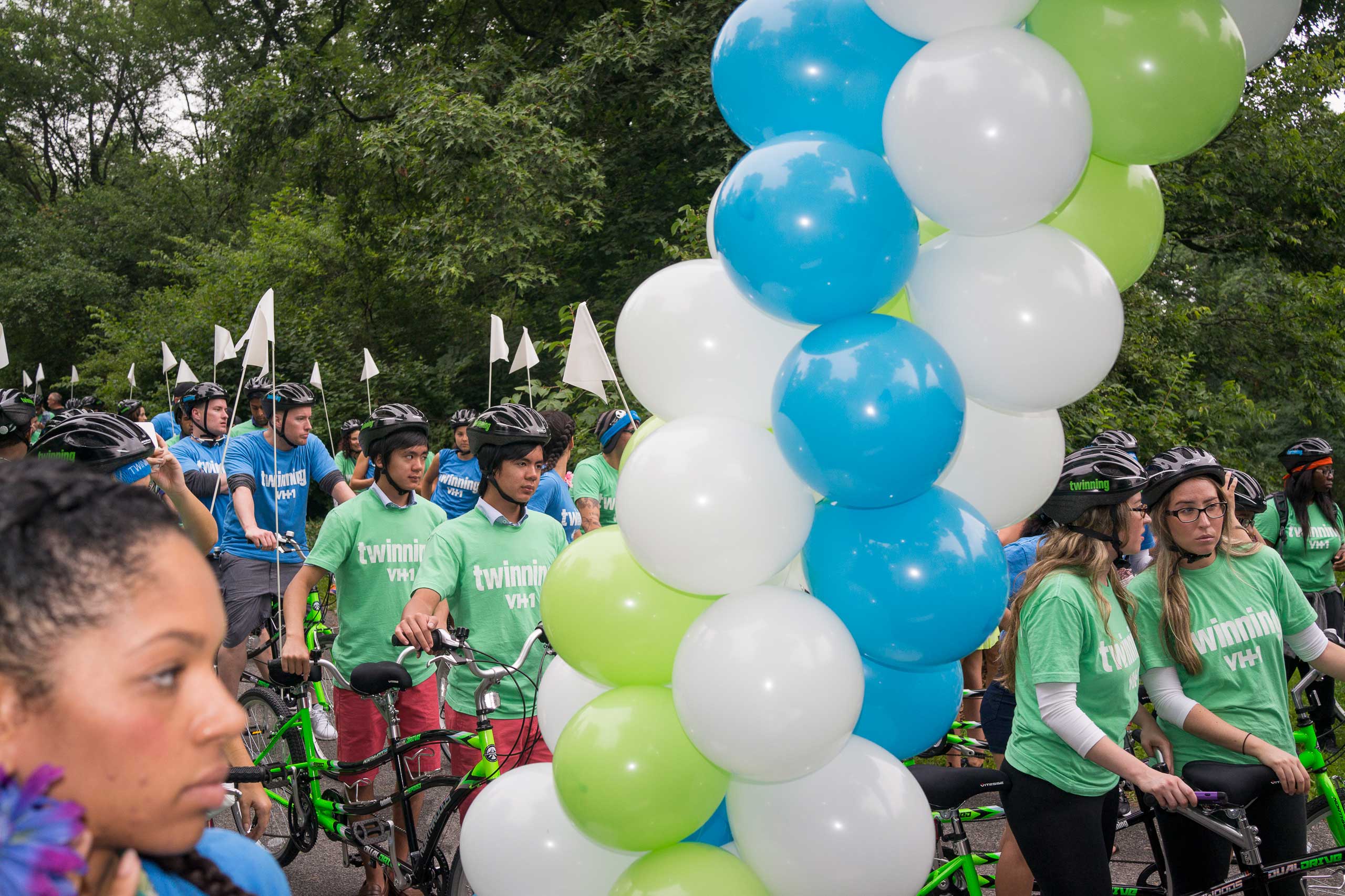 Twins gather before riding tandem bikes in an attempt to set the record for the most twins ever riding tandem bikes, in Central Park in New York City on July 15, 2015.