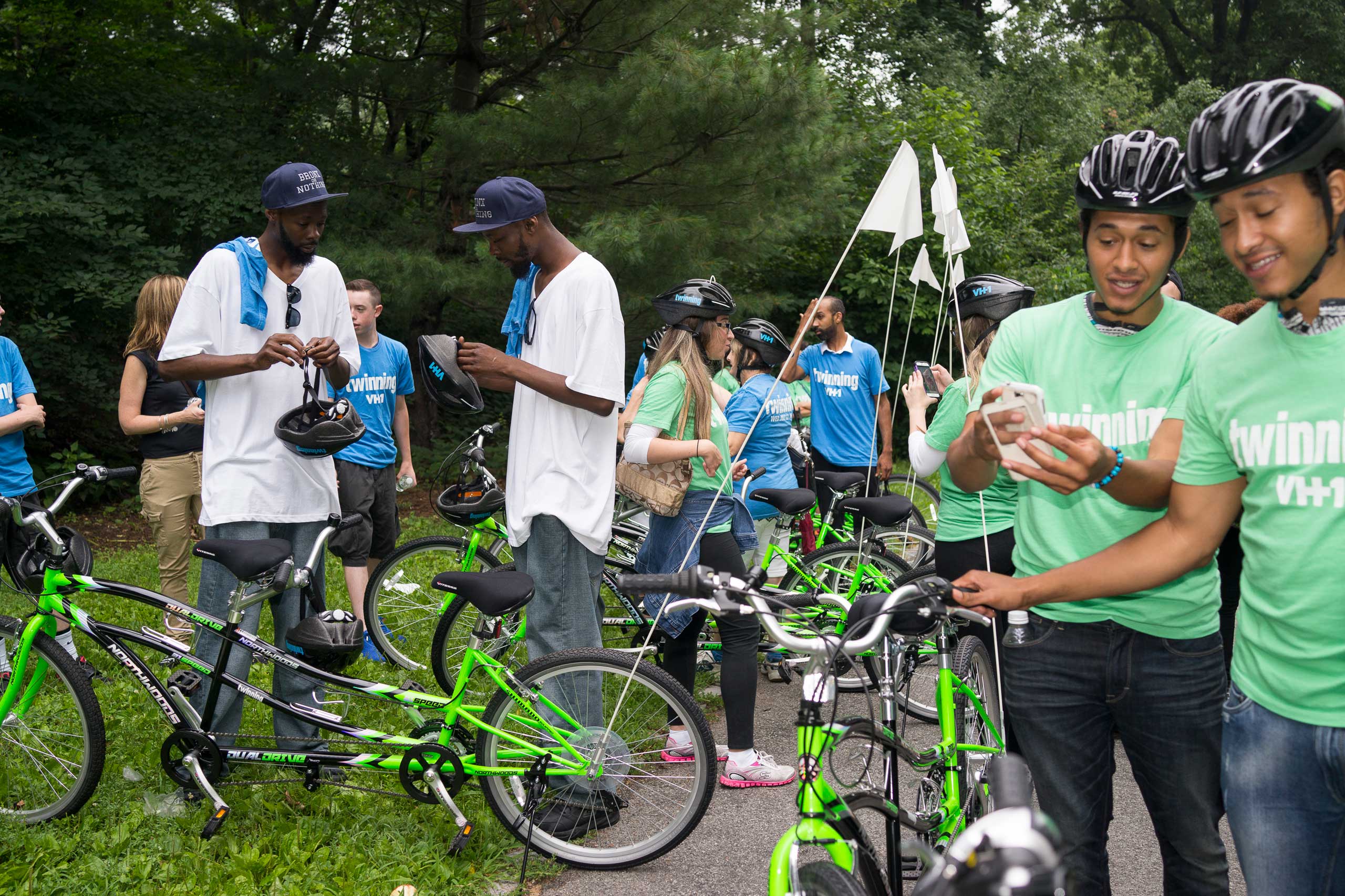 Twins gather before hundreds of twins ride tandem bikes in an attempt to set the record for the most twins ever riding tandem bikes, in Central Park in New York City on July 15, 2015.