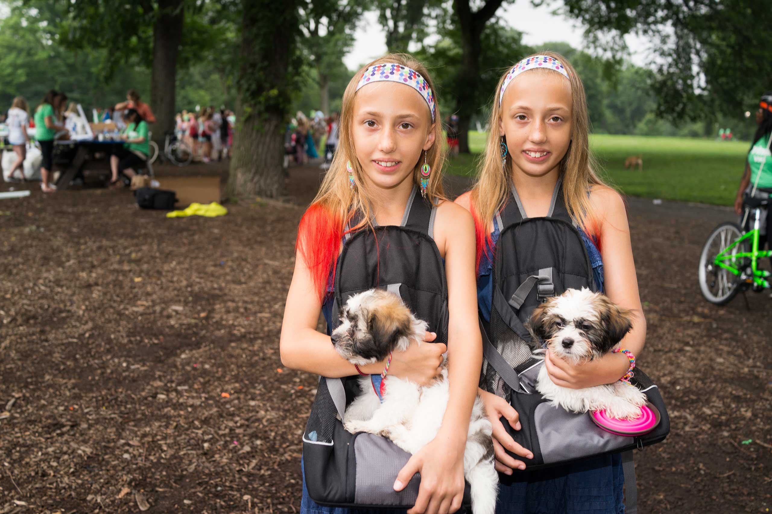 Aryana and Bryonna Kristofsen, both 10, pose for a photograph before hundreds of twins ride tandem bikes in an attempt to set the record for the most twins ever riding tandem bikes, in Central Park in New York City on July 15, 2015.