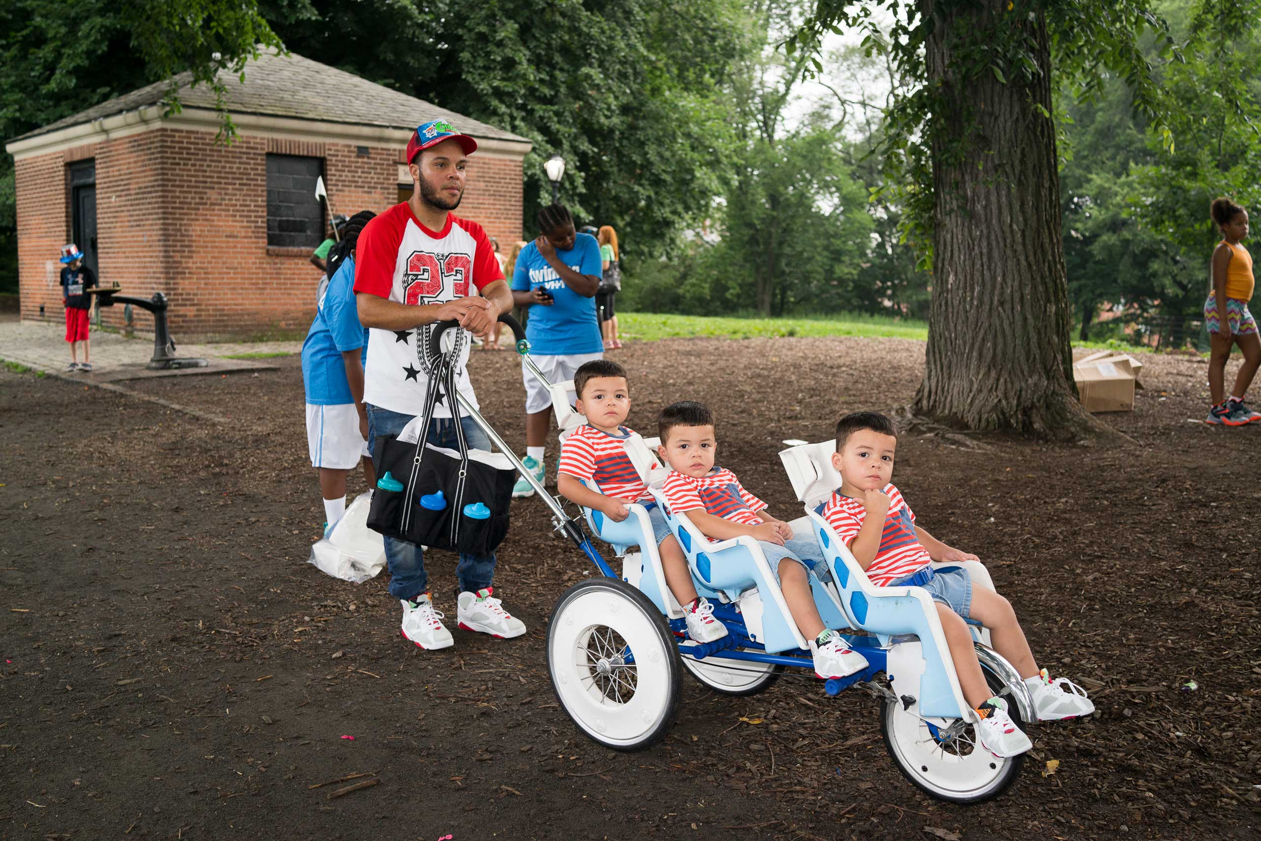Alex, Aithon, Abraham and Andrick Genao, from Baltimore, gather as hundreds of twins ride tandem bikes in an attempt to set the record for the most twins ever riding tandem bikes, in Central Park in New York City on July 15, 2015.